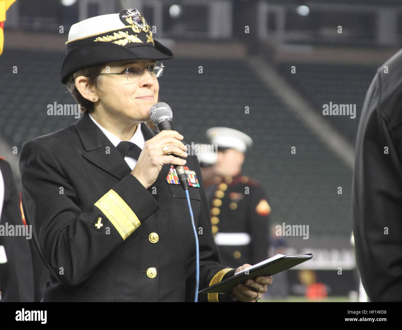 Rear Adm. Margaret Kibbin, the chaplain of the United States Marine Corps, delivers the invocation before the Semper Fidelis All-American Bowl at The StubHub Center in Carson, Calif., Jan. 5, 2014. The Semper Fidelis Football Program brought together over 90 of the best high-school football players in an East versus West game and is an opportunity for the Marine Corps to connect on a personal and local level with players and influencers, demonstrates commitment to developing quality citizens, and reinforces how core values of honor, courage and commitment relate to success on and off the field Stock Photo