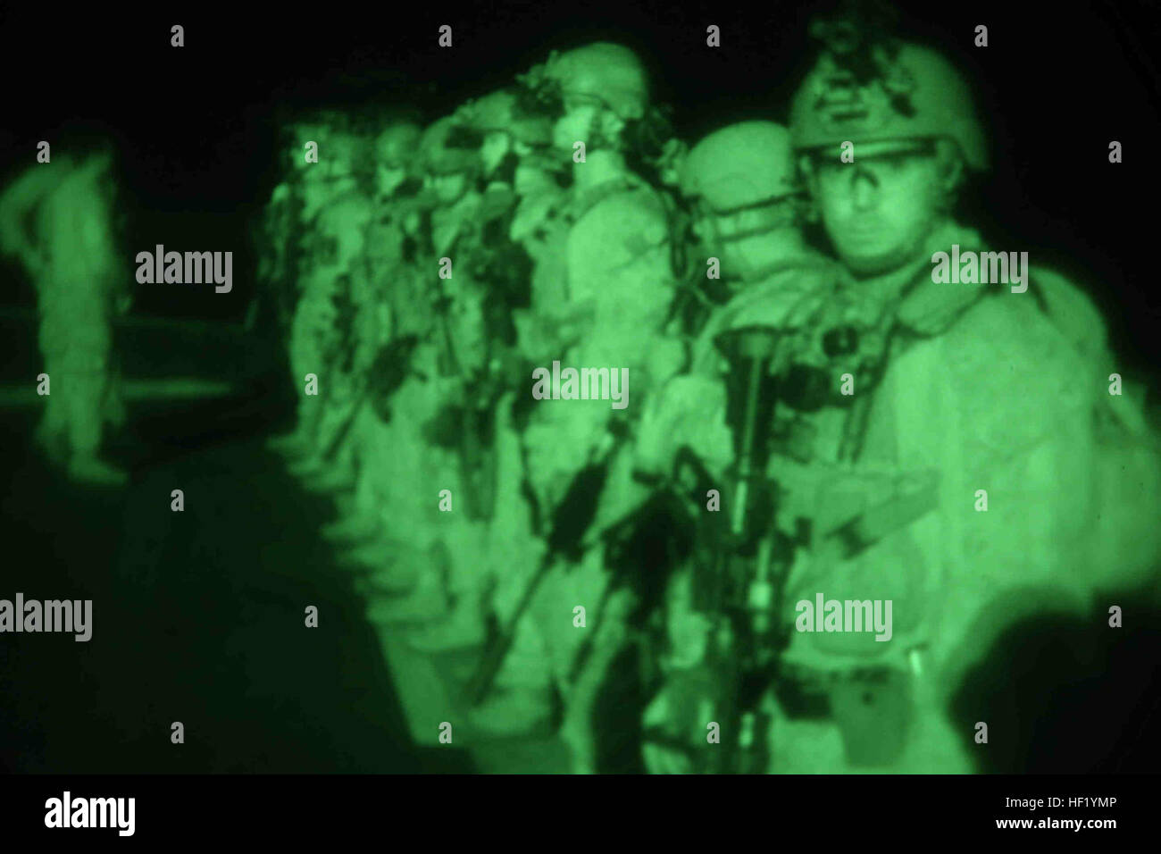 U.S. Marines assigned to Reconnaissance Platoon, Battalion Landing Team 1/4, 13th Marine Expeditionary Unit (MEU), prepare to conduct live night fire aboard USS Boxer (LHD 4), Feb. 24, 2014. The 13th MEU is deployed with the Boxer Amphibious Ready Group as a theater reserve and crisis response force throughout the U.S. 5th Fleet area of responsibility. (U.S. Marine Corps photo by Gunnery Sgt. Ajiboye Magbagbeola, 13th Marine Expeditionary Unit Combat Camera/Released) USS Boxer 140224-M-FC972-001 Stock Photo