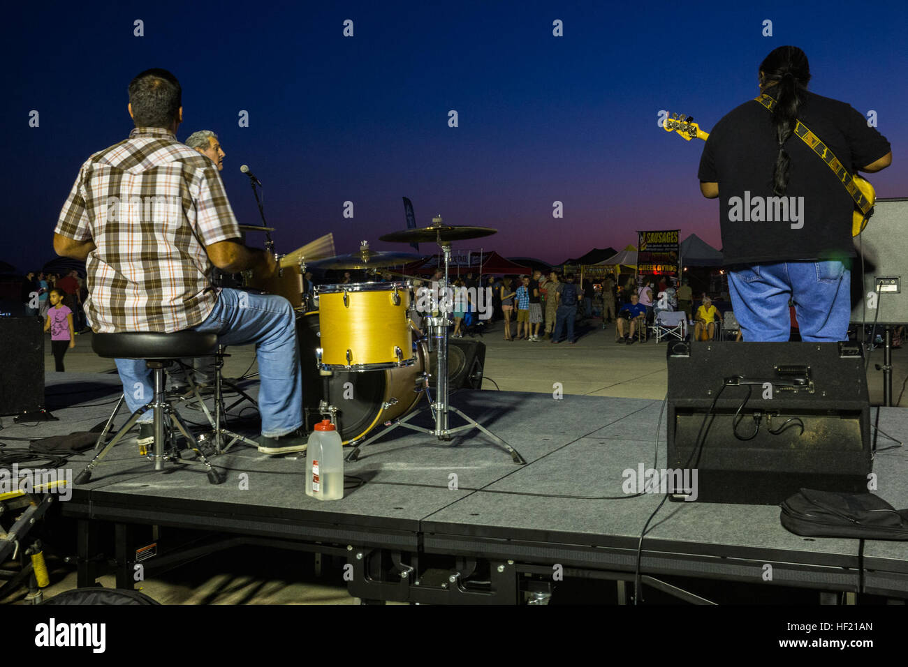 Tommy and the Drifters, a local band favorite from Yuma, Ariz., perform aboard the flight line of Marine Corps Air Station Yuma, Ariz., Friday evening. YumaE28099s Airshow, A Twilight Showcasing For All 140314-M-NB398-077 Stock Photo