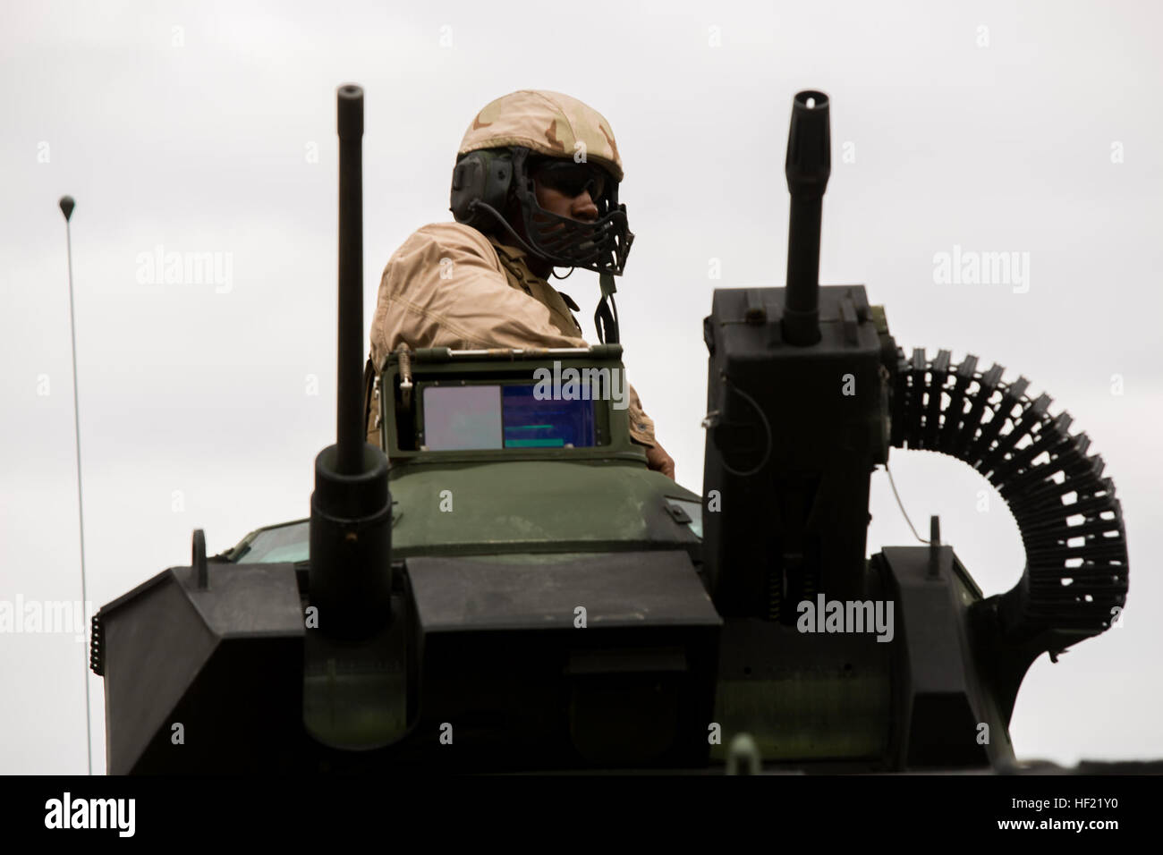 U.S. Marine Corps Lance Cpl. Horace Leonard an Assault Amphibious Vehicle (AAV) Crewmember, with Charlie Company, 3rd Assault Amphibious Battalion, 1st Marine Division, sits in the turrent of an AAV at a live fire training event during Exercise Ssang Yong 14 at Suesongri, South Korea, March 26, 2014. Exercise Ssang Yong 14 is conducted annually in the Republic of Korea (ROK) to enhance interoperablility between U.S. and ROK forces by performing a full spectrum of amphibious operations while showcasing sea-based power projection in the Pacific. (U.S. Marine Corps Photo by Lance Cpl Tyler S. Die Stock Photo