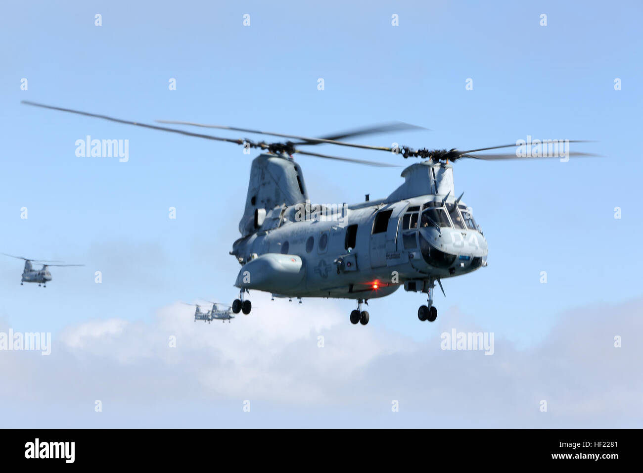 U.S. Marines with Marine Medium Helicopter Squadron (HMM) 364, Marine Aircraft Group 39, 3rd Marine Aircraft Wing (MAW), fly CH-46E Sea Knight helicopters over San Diego, Calif., March 31, 2014. After 47 years of flying the CH-46, HMM-364, “Flies the Barn”, taking off and landing in unison and flying in mass formations, signifying the transition to the MV-22 Osprey. (U.S. Marine Corps photo by Sgt. Keonaona C. Paulo, 3rd MAW Combat Camera/Released) Purple Foxes 'Fly the Barn' 140331-M-EF955-079 Stock Photo