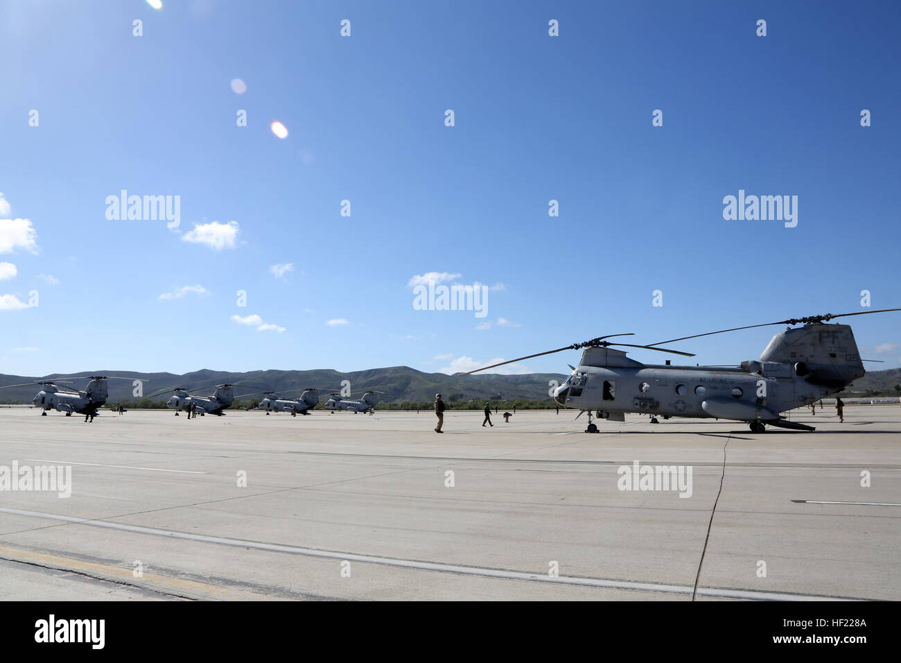 U.S. Marines with Marine Medium Helicopter Squadron (HMM) 364, Marine Aircraft Group 39, 3rd Marine Aircraft Wing (MAW), land CH-46E Sea Knight helicopters at Camp Pendleton, Calif., March 31, 2014. After 47 years of flying the CH-46, HMM-364, “Flies the Barn”, taking off and landing in unison and flying in mass formations, signifying the transition to the MV-22 Osprey. (U.S. Marine Corps photo by Sgt. Keonaona C. Paulo, 3rd MAW Combat Camera/Released) Purple Foxes 'Fly the Barn' 140331-M-EF955-151 Stock Photo