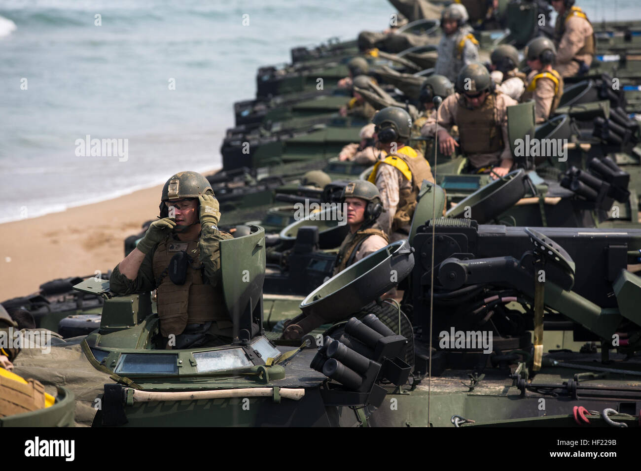 U.S. Marines with the 2nd Battalion, 3rd Marine Regiment, attached to the 4th Marine Regiment, line up in assault amphibious vehicles at Dogu Beach in Pohang, South Korea, April 1, 2014, during Ssang Yong 14 as part of Marine Expeditionary Force Exercise (MEFEX) 2014. MEFEX 2014 was a U.S. Marine Corps Forces Pacific-sponsored series of exercises between the U.S. Navy and Marine Corps and South Korean forces. Among the exercises were the Korean Marine Exchange Program, Freedom Banner 14, Ssang Yong 14, Key Resolve 14 and the Combined Marine Component Command 14 command post exercise. (DoD phot Stock Photo