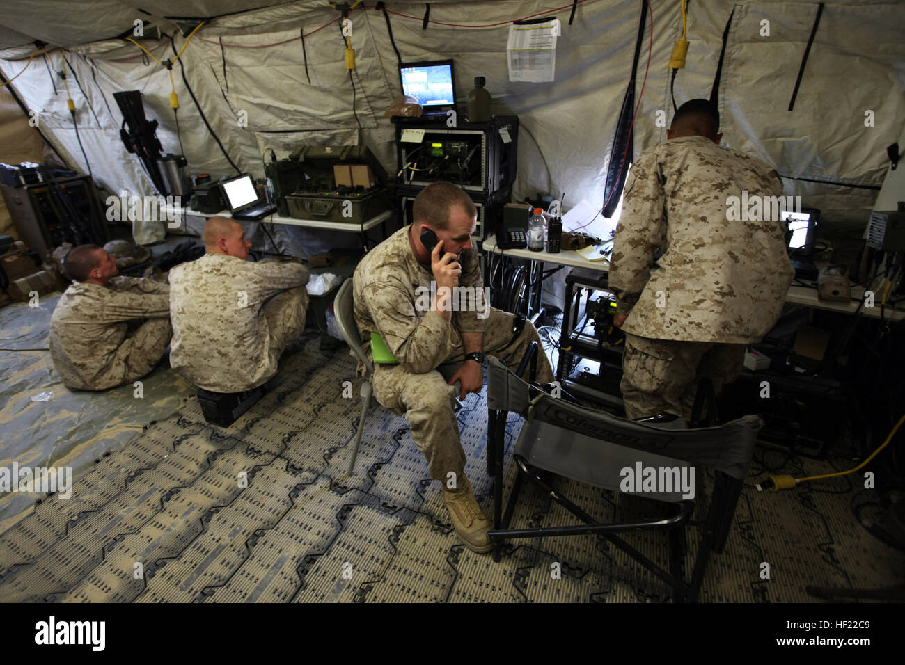 Marines of the 31st Marine Expeditionary Unit's Command Element monitor radio traffic in the command operations center for Regimental Landing Team 31, 3d Marine Expeditionary Brigade, as part of Exercise Ssang Yong 2014 here, April 2. For the duration of the exercise, the 31st MEU's CE became RLT-31, which is the ground combat element of 3d MEB for the bilateral training exercise with Republic of South Korea forces. RLT-31 consists of Battalion Landing Teams 2nd Battalion, 5th Marines; 1st Battalion, 4th Marines; 2nd Battalion, 3rd Marines; as well as elements of 1st Tank Battalion, 4th Tank B Stock Photo