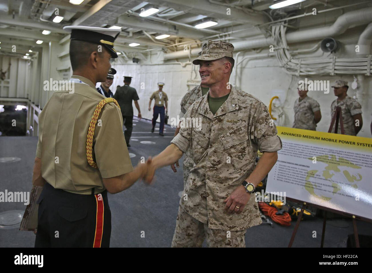 Lieutenant Col. Mark T. Donar, commanding officer, Special Purpose Marine Air-Ground Task Force Association of South East Asian Nations, greets an official with the Philippine Marine Corps during a static display aboard amphibious transport dock ship USS Anchorage (LPD 23) in support of the ASEAN conference held by U.S. Secretary of Defense Chuck Hagel in Hawaii, April 2, 2014. Delegates and media personnel, from 10 Southeast Asian countries, attended the exhibit to learn more about the Navy and Marine Corps' humanitarian aid and disaster relief capabilities. As subject matter experts with fir Stock Photo