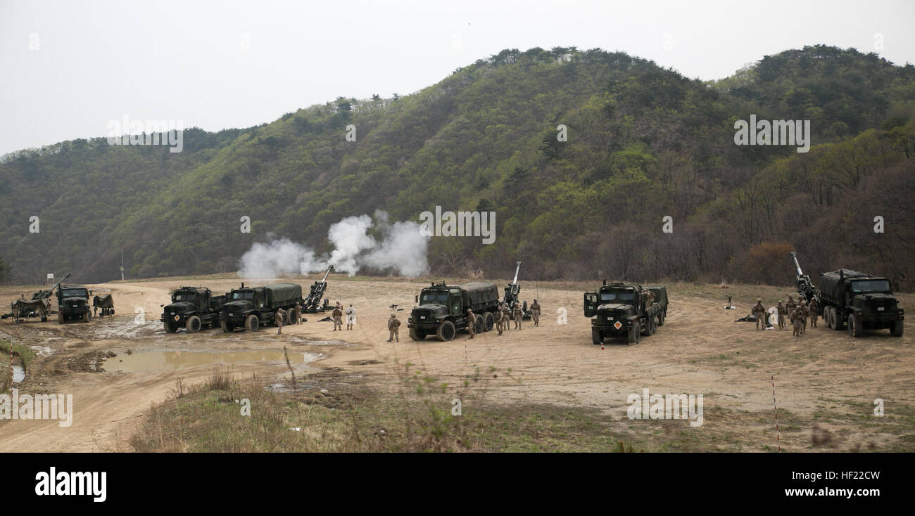 Artillery Marines fire off rounds from M777A2 lightweight 155 mm howitzers April 3 at Su Seung-ri Range in the Republic of Korea as part of Exercise Ssang Yong 2014. The Marines shot off eight rounds during the calibration portion of the live-fire, followed by another 40 rounds in succession. Ssang Yong is an exercise that showcases the amphibious and expeditionary capabilities of the ROK and U.S. forces as well as the maturity of the relationship between the two nations. The Marines are with Golf Battery, 2nd Battalion, 11th Marine Regiment currently assigned to Battalion Landing Team 2nd Bn. Stock Photo