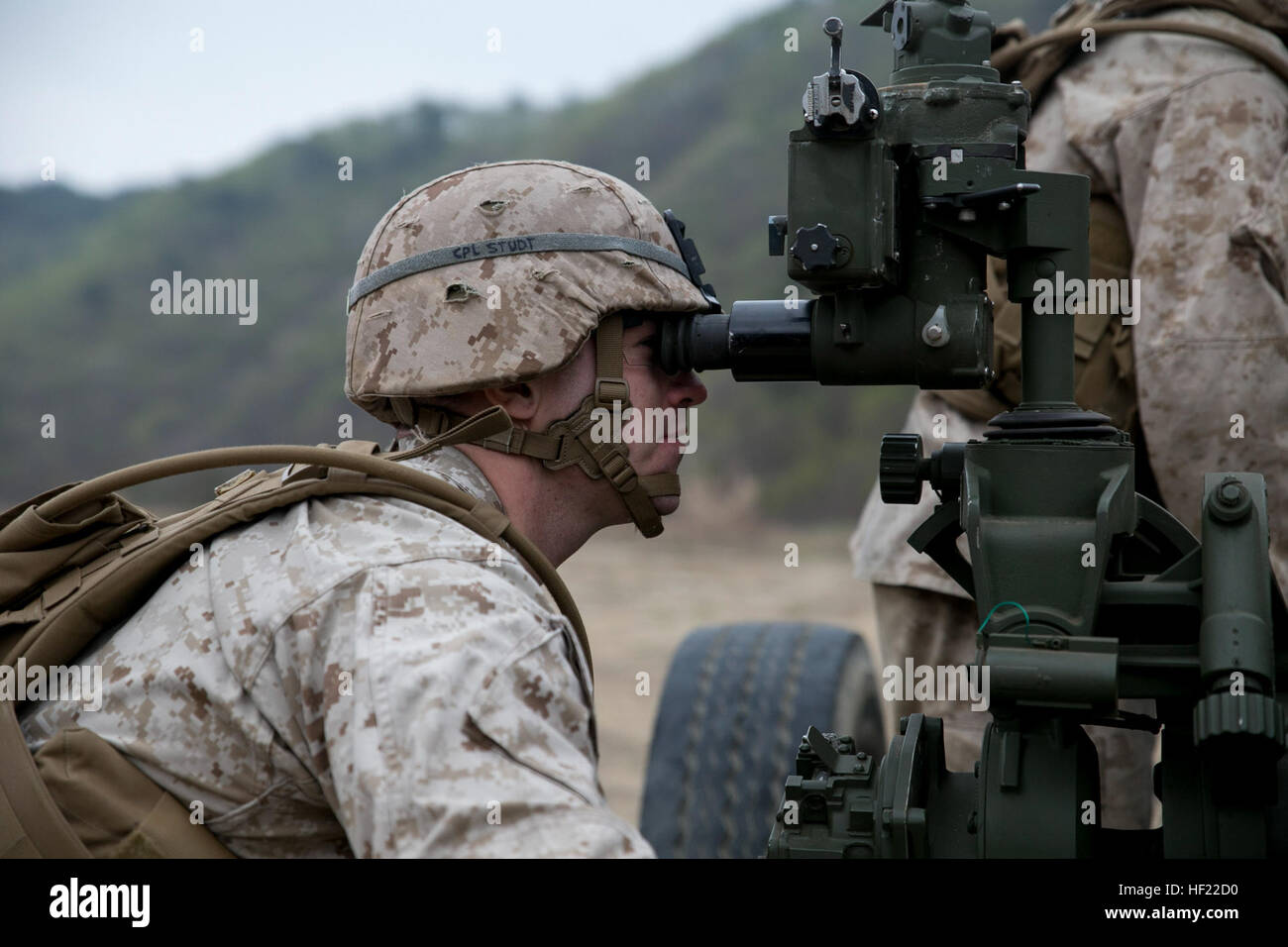 Cpl. Chase Studt checks the calibration of a M777A2 lightweight 155 mm howitzer during a live-fire training April 3 at Su Seung-ri Range in the Republic of Korea as part of Exercise Ssang Yong 2014. Ssang Yong is an exercise that showcases the amphibious and expeditionary capabilities of the ROK and U.S. forces as well as the maturity of the relationship between the two nations. Studt, a native of Cedar Rapids, Iowa, is a field artillery cannoneer with Golf Battery, 2nd Battalion, 11th Marine Regiment currently assigned to Battalion Landing Team 2nd Bn., 5th Marines, 31st Marine Expeditionary  Stock Photo