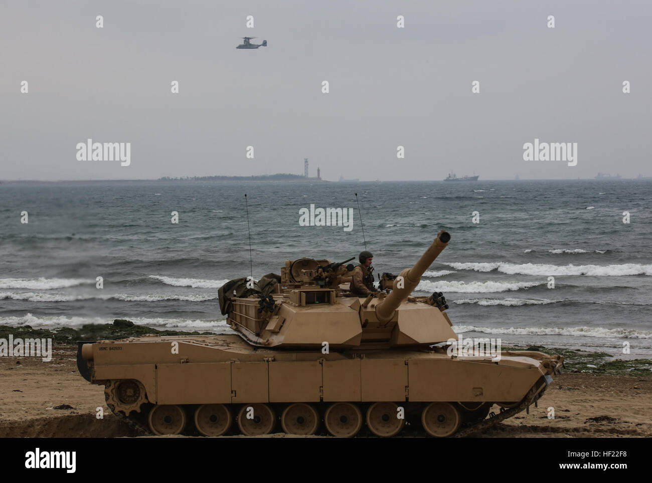 Marines with Charlie Company, 4th Tanks Battalion, drive a M1A1 Tank onto Dogue Beach during exercise Ssang Yong, Pohang, South Korea,  April 3, 2014. Exercise Ssang Yong is conducted annually in the ROK to enhance interoperability between U.S. and ROK forces by performing a full spectrum of amphibious operations while showcasing sea-based power projection in the Pacific. (U.S. Marine Corps photo by Cpl. Lauren Whitney/Released) Ssang Yong 14 140403-M-GZ082-229 Stock Photo