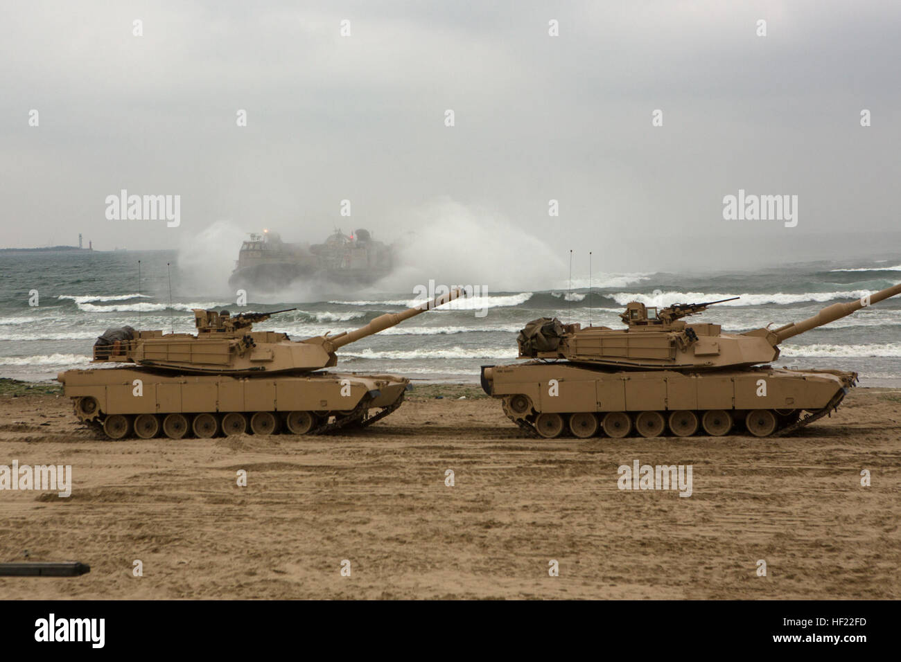 U.S. Marine Corps M1A1 Abrams Tanks with Charlie Company, 4th Tank Battalion, 4th Marine Division attached to III Marine Expeditionary Brigade are offloaded from Landing Craft Air Cushioned during Exercise Ssang Yong 14 at Dogue Beach, Pohang, South Korea, April 3, 2014. Exercise Ssang Yong is conducted annually in the ROK to enhance interoperability between U.S. and ROK forces by performing a full spectrum of amphibious operations while showcasing sea-based power projection in the Pacific. (U.S. Marine Corps Photo by Cpl. Sara A. Medina, III MEF Combat Camera/Released) M1A1 Abrams Tanks offlo Stock Photo