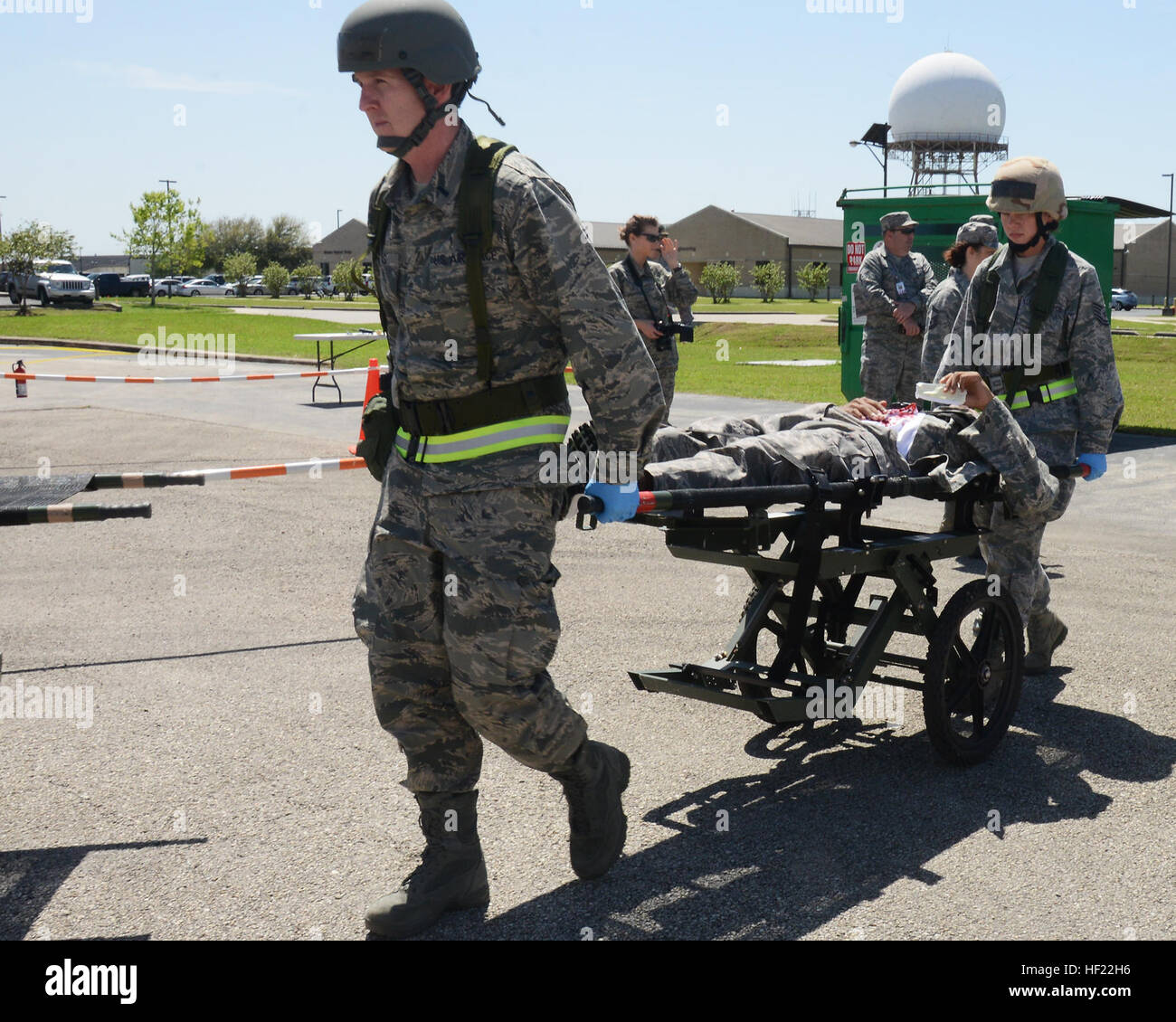 Members of the 147th Reconnaissance Wing Medical Group evacuate a simulated victim of a mass