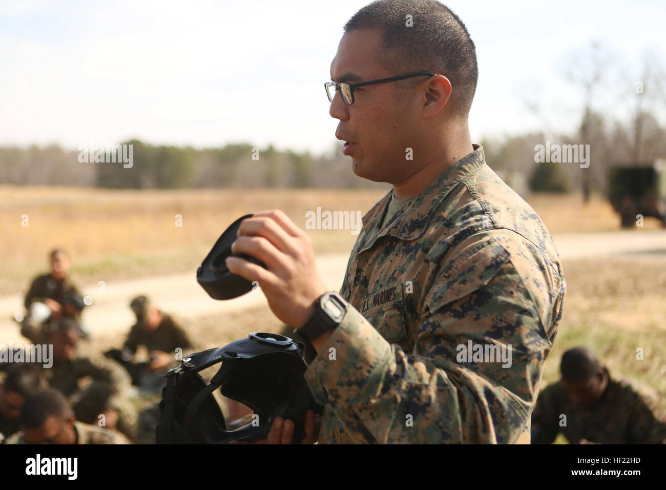 Corporal Mauliola J. Watson, the Chemical Biological Radiological Nuclear Defense chief for 2nd Tank Battalion, 2nd Marine Division, and native of Hilo, Hawaii, teaches Marines about the M50 field protective mask during a month-long field exercise at Ft. Pickett, Va., April 4, 2014. Marines with the battalion completed individual survival standards as part of their annual training requirement. 2nd Tanks gets gassed 140404-M-BW898-001 Stock Photo