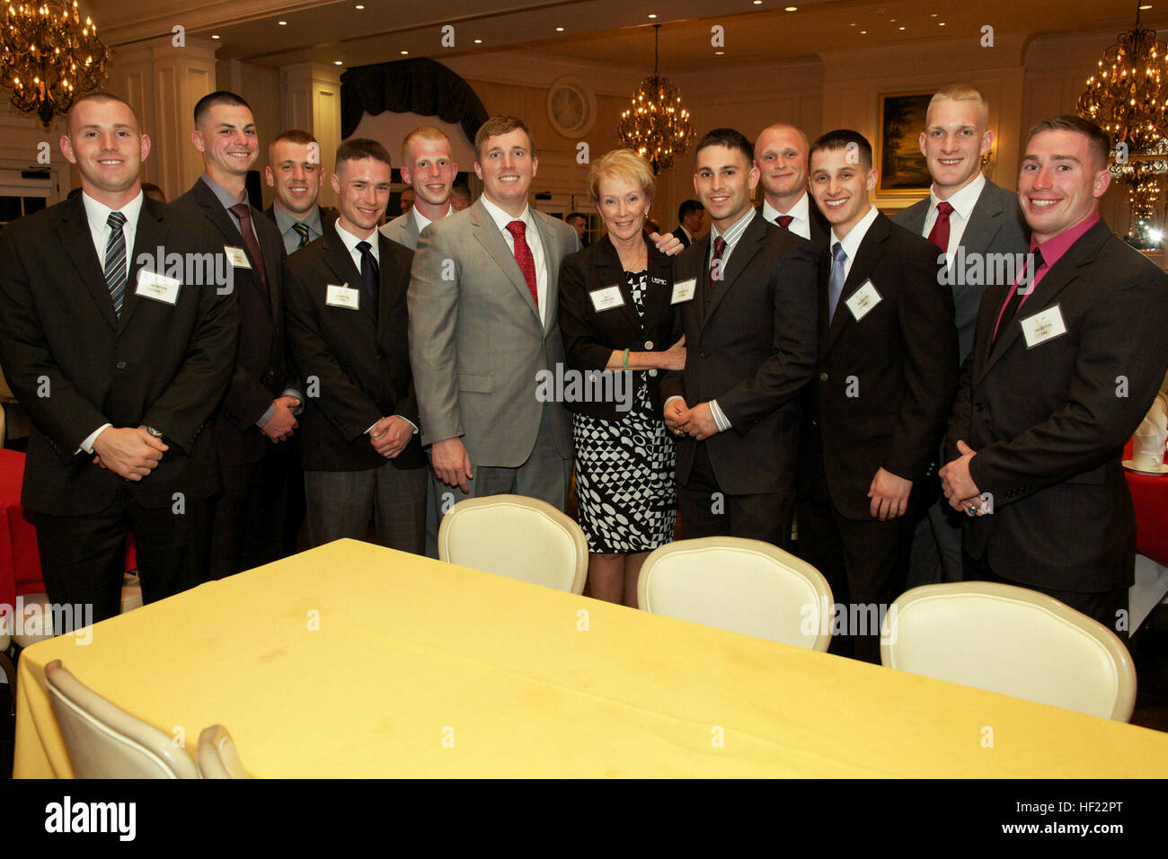 The First Lady of the Marine Corps, Bonnie Amos, center right, and Medal of Honor recipient Sgt. Dakota Meyer, center left, pose for a photo with Marines from The Basic School during a dinner hosted by the Marine Corps Aviation Association at the Army Navy Country Club in Arlington, Va., April 8, 2014. (U.S. Marine Corps photo by Sgt. Mallory S. VanderSchans/Released) Marine Corps Commandant Attends Marine Corps Aviation Association Dinner 140408-M-LU710-126 Stock Photo