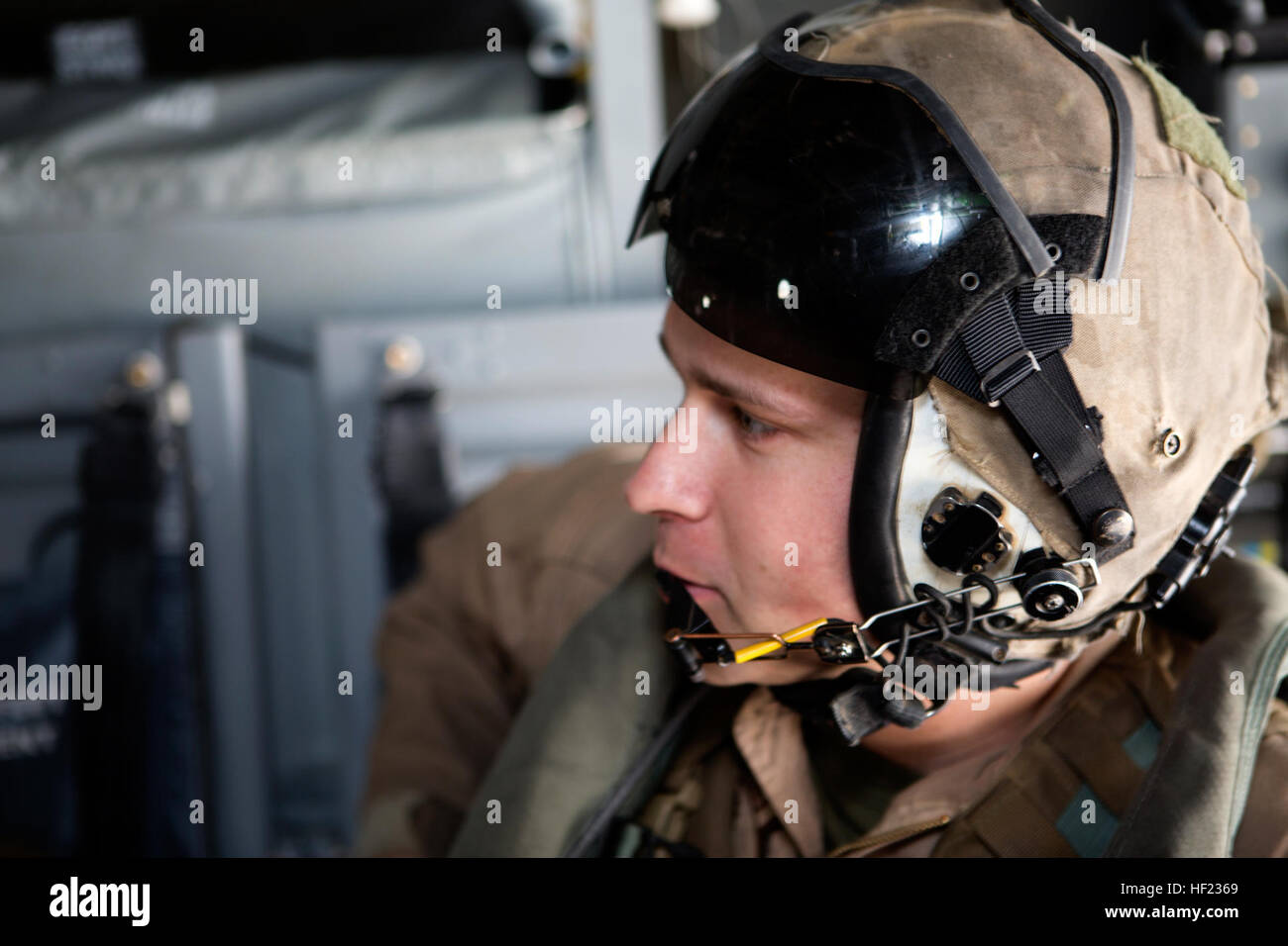 U.S. Marine Corps Sgt. Robert M. Howard, a crew chief with Marine Medium Tiltrotor Squadron (VMM) 266, prepares for an aerial refueling exercise at Marine Corps Air Station New River, N.C., April 14, 2014. Howard monitored the rear components of an MV-22 Osprey assigned to VMM-266. (U.S. Marine Corps photo by Lance Cpl. Jodson B. Graves/Released) VMGR-252, VMM-264 and 266 Aerial Refuelinng Training Exercise 140414-M-SW506-019 Stock Photo