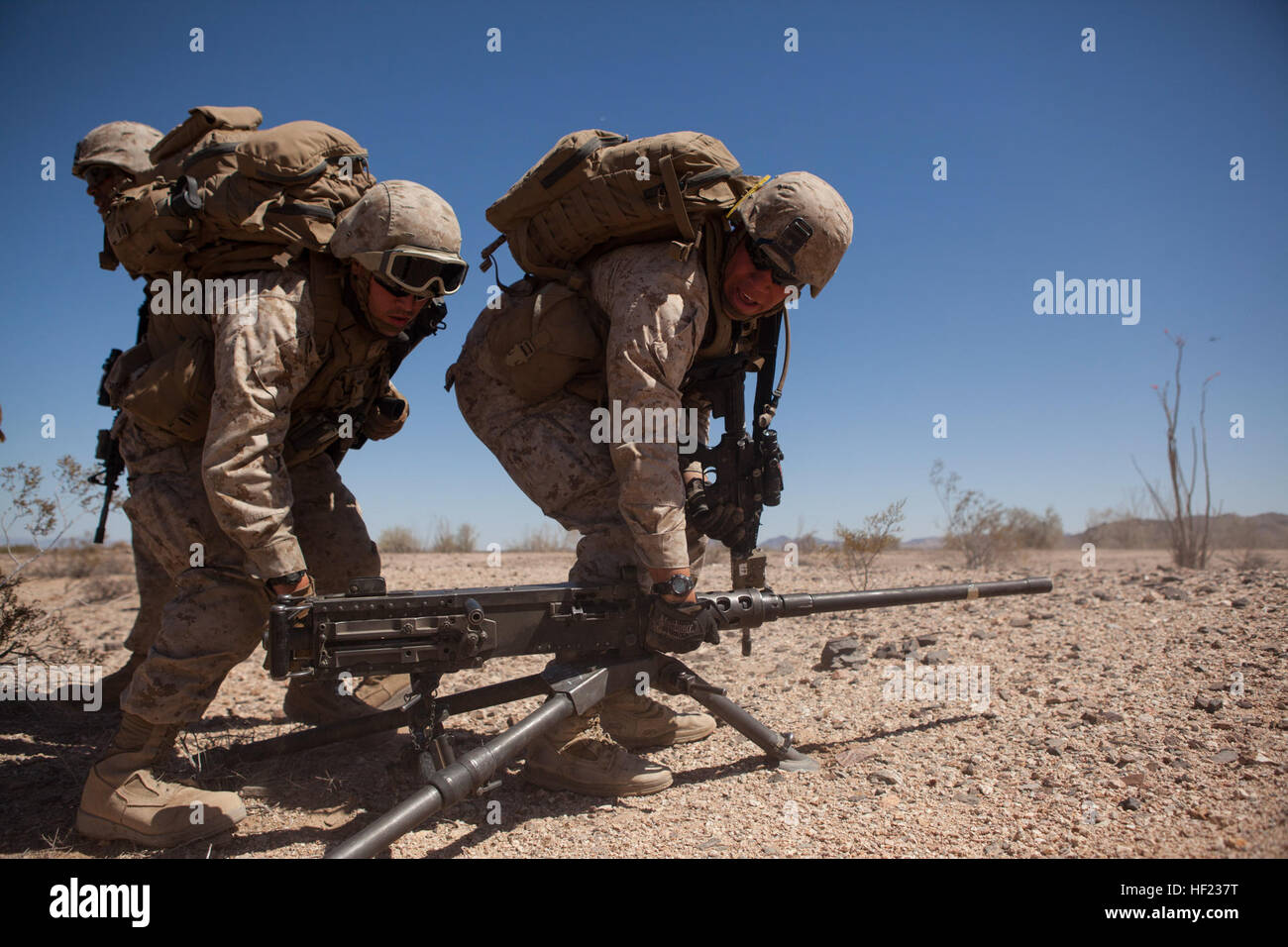 U.S. Marine Corps Pfc. Quinn Wells, left, machine gunner, 3rd Battalion ...