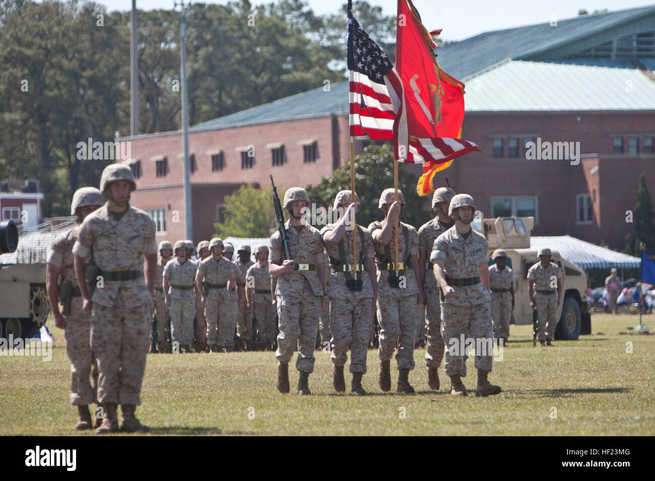 U.S. Marines with 2nd Tank Battalion (2nd Tank Bn), 2nd Marine Division (2nd MARDIV), march on the colors during a retirement ceremony for Sgt. Maj. James Brooks, outgoing battalion sergeant major, 2nd Tank Bn, 2nd MARDIV, at the William P.T. Field, Camp Lejeune, N.C., April 24, 2014.  Brooks retired after 30 years of military service. (U.S. Marine Corps photo by Lance Cpl. David McKenzie, 2nd MARDIV, Combat Camera/Released) Sgt. Maj. Brooks retires after 30 years of service 140424-M-HZ136-127 Stock Photo