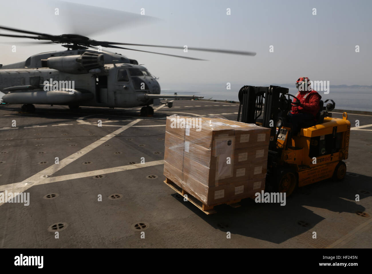 U.S. Marines with Marine Heavy Helicopter Squadron (HMH) 464, Detachment A, 31st Marine Expeditionary Unit, conduct a logistic resupply mission in a CH-53E Super Stallion helicopter from the U.S.S. Sacagawea during exercise Ssang Yong 2014 on April 1, 2014. Exercise Ssang Yong is conducted annually in the Republic of Korea (ROK) to enhance the interoperability of U.S. and ROK forces by performing a full spectrum of amphibious operations while showcasing sea-based power projection in the Pacific. (U.S. Marine Corps Photo by Chief Warrant Officer Clinton Runyon, MCIPAC Combat Camera/Released). S Stock Photo