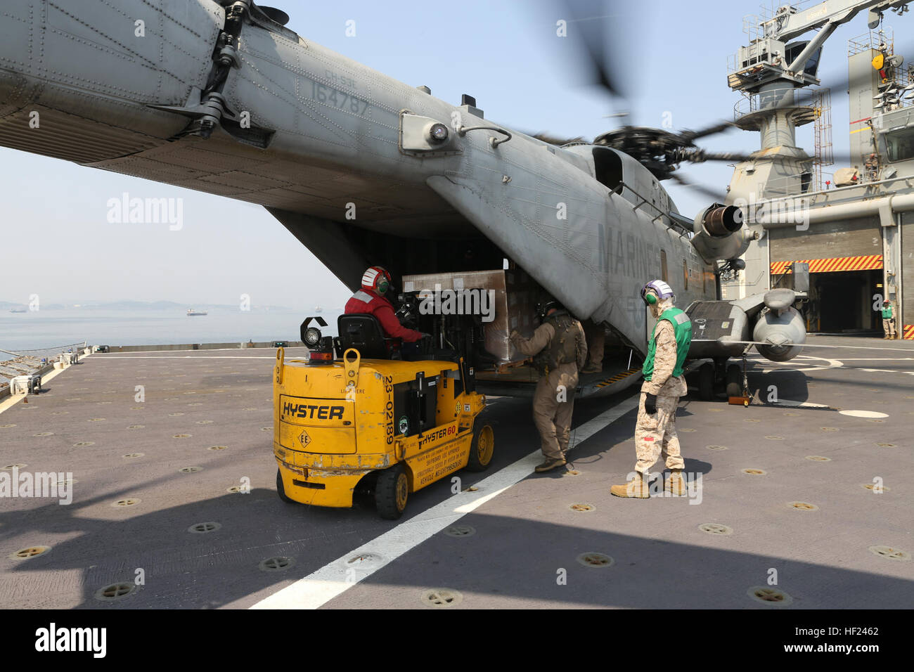 U.S. Marines with Marine Heavy Helicopter Squadron (HMH) 464, Detachment A, 31st Marine Expeditionary Unit, conduct a logistic resupply mission in a CH-53E Super Stallion helicopter from the U.S.S. Sacagawea during exercise Ssang Yong 2014 on April 1, 2014. Exercise Ssang Yong is conducted annually in the Republic of Korea (ROK) to enhance the interoperability of U.S. and ROK forces by performing a full spectrum of amphibious operations while showcasing sea-based power projection in the Pacific. (U.S. Marine Corps Photo by Chief Warrant Officer Clinton Runyon, MCIPAC Combat Camera/Released). S Stock Photo