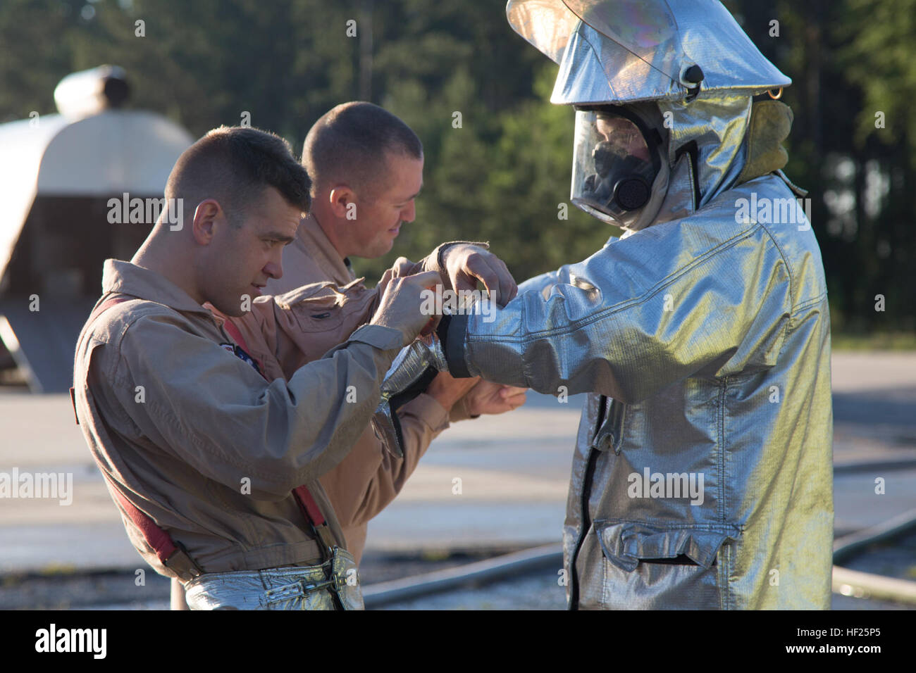 U.S. Marines with Aircraft Rescue and Fire Fighting (ARFF), Headquarters & Headquarters Squadron, Marine Corps Air Station Beaufort, conduct a safety check before beginning their monthly fuel burn training aboard Marine Corps Air Station Beaufort, S.C., May 16, 2014. ARFF conducts monthly fuel burns to ensure all Marines are competent in their occupational specialty and able to be called upon at a moments notice. (U.S. Marine Corps photo by Cpl. Aneshea S. Yee/Released) F-A-18 Fuel Burn Simulation 140516-M-XK446-062 Stock Photo