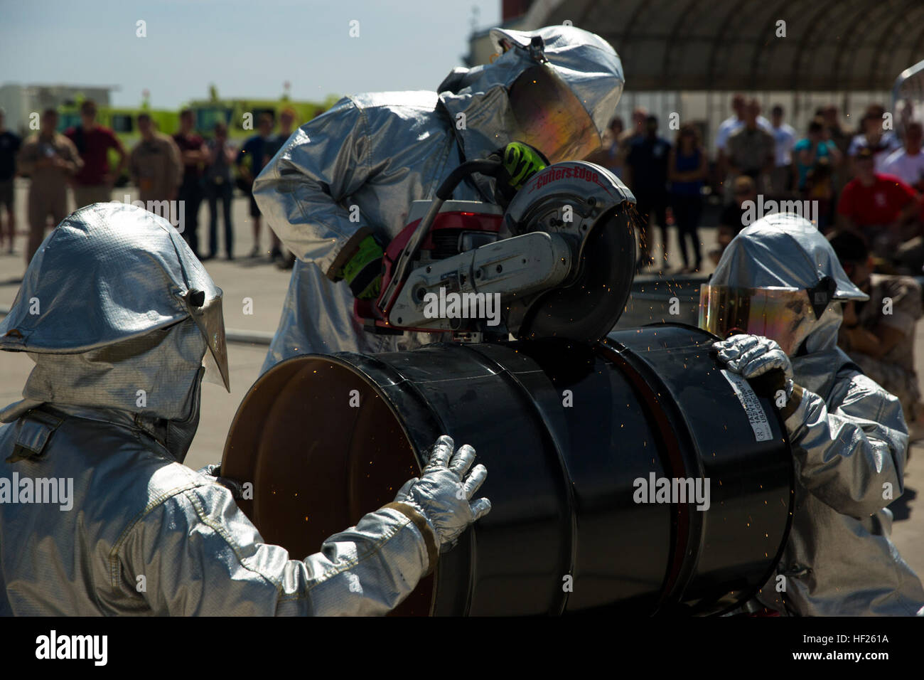 Aircraft Rescue and Fire Fighting Marines saw through a barrel as part ...