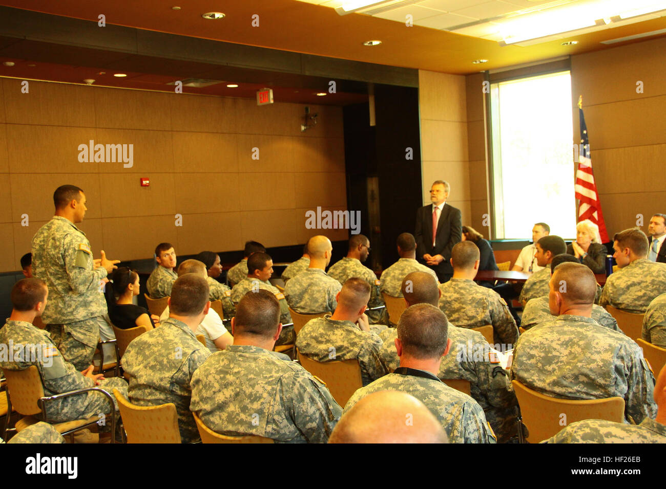 Mark Pekela, the United States ambassador to Latvia, fields questions from U.S. Army paratroopers from 1st Battalion, 503rd Infantry Regiment, 173rd Airborne Brigade, during a May 22, 2014, visit to the U.S. Embassy in Riga, Latvia. The paratroopers were participating in a cultural day where they met with Latvian citizens, learned the history of the city, and toured the U.S. Embassy. The paratroopers have been in Latvia since early April when more than 600 paratroopers with the 173rd Airborne traveled to Estonia, Latvia, Lithuania and Poland as part of an unscheduled land-forces exercise to de Stock Photo