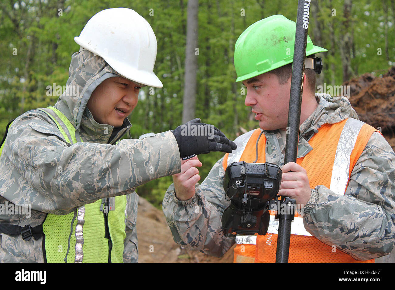 Master Sgt. Harold Bauzon and Staff Sgt. Luke Lavigne discuss a site