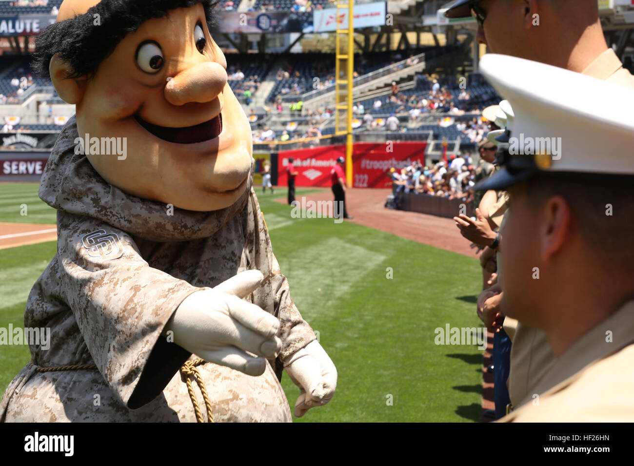 The San Diego Padres mascot, the Swinging Friar, greets Marines and sailors  with 3rd Battalion, 4th Marines, 7th Marine Regiment, during their  appearance at a military appreciation ceremony at a San Diego