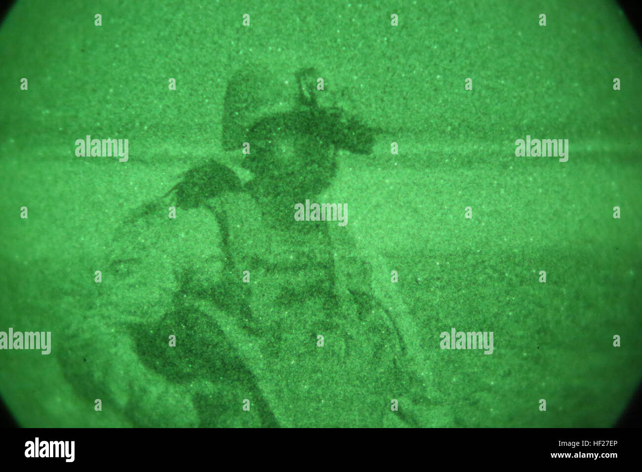 Staff Sgt. Devon Fischer, a platoon sergeant with Bravo Company, 1st Battalion, 7th Marine Regiment, and a native Hillsborough, North Carolina, patrols to a landing zone under the cover of night during a mission in Helmand province, Afghanistan, June 6, 2014. The company conducted disruption operations in a known Taliban bed-down location for two days. During the previous mission May 29, the company discovered a drug production lab and removed more than one metric ton of narcotics from the battlefield. (U.S. Marine Corps photo by Cpl. Joseph Scanlan / released) Marines confiscate more than one Stock Photo