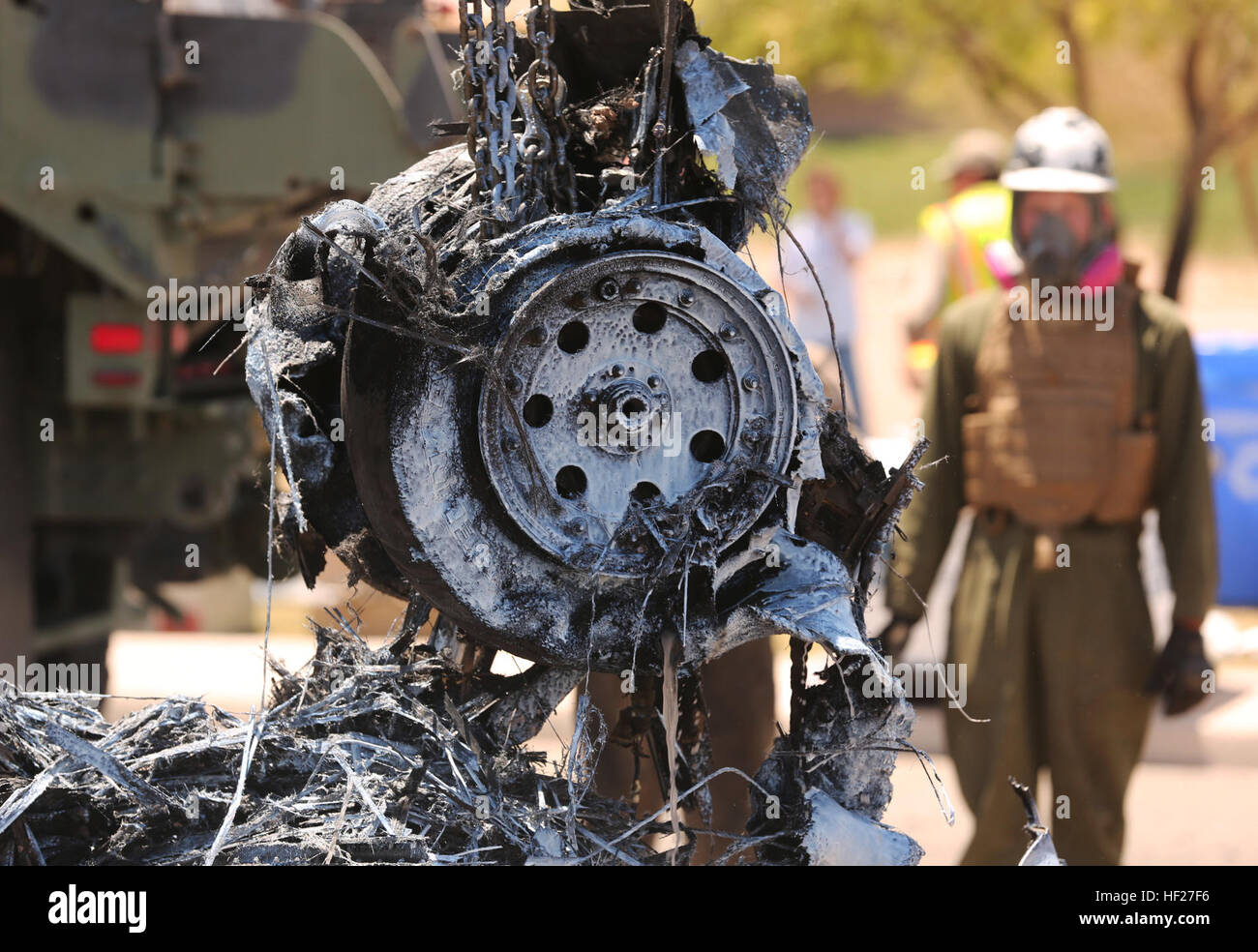 Aircraft debris is removed by crane from the AV8B Harrier II crash