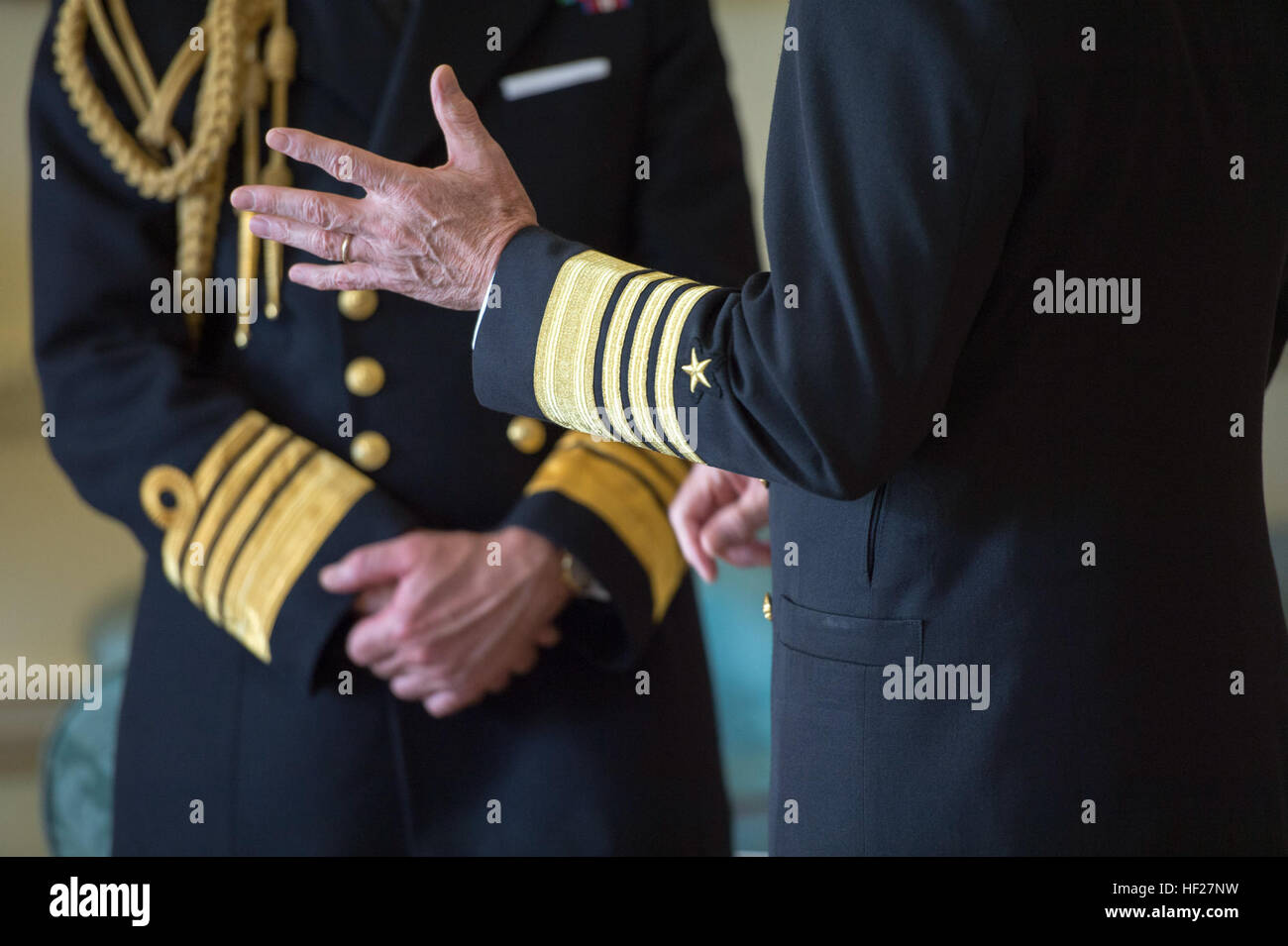 Chief of Naval Operations U.S. Navy Adm. Jonathan Greenert, right, talks with British Chief of Naval Staff Adm. Sir George Zambellas before a meeting with British Prime Minister David Cameron June 10, 2014, during a defense chiefs strategic dialogue in London. (DoD photo by Mass Communication Specialist 1st Class Daniel Hinton, U.S. Navy/Released) US, UK Joint Chiefs of Staff talk collaboration 140610-D-KC128-444 Stock Photo
