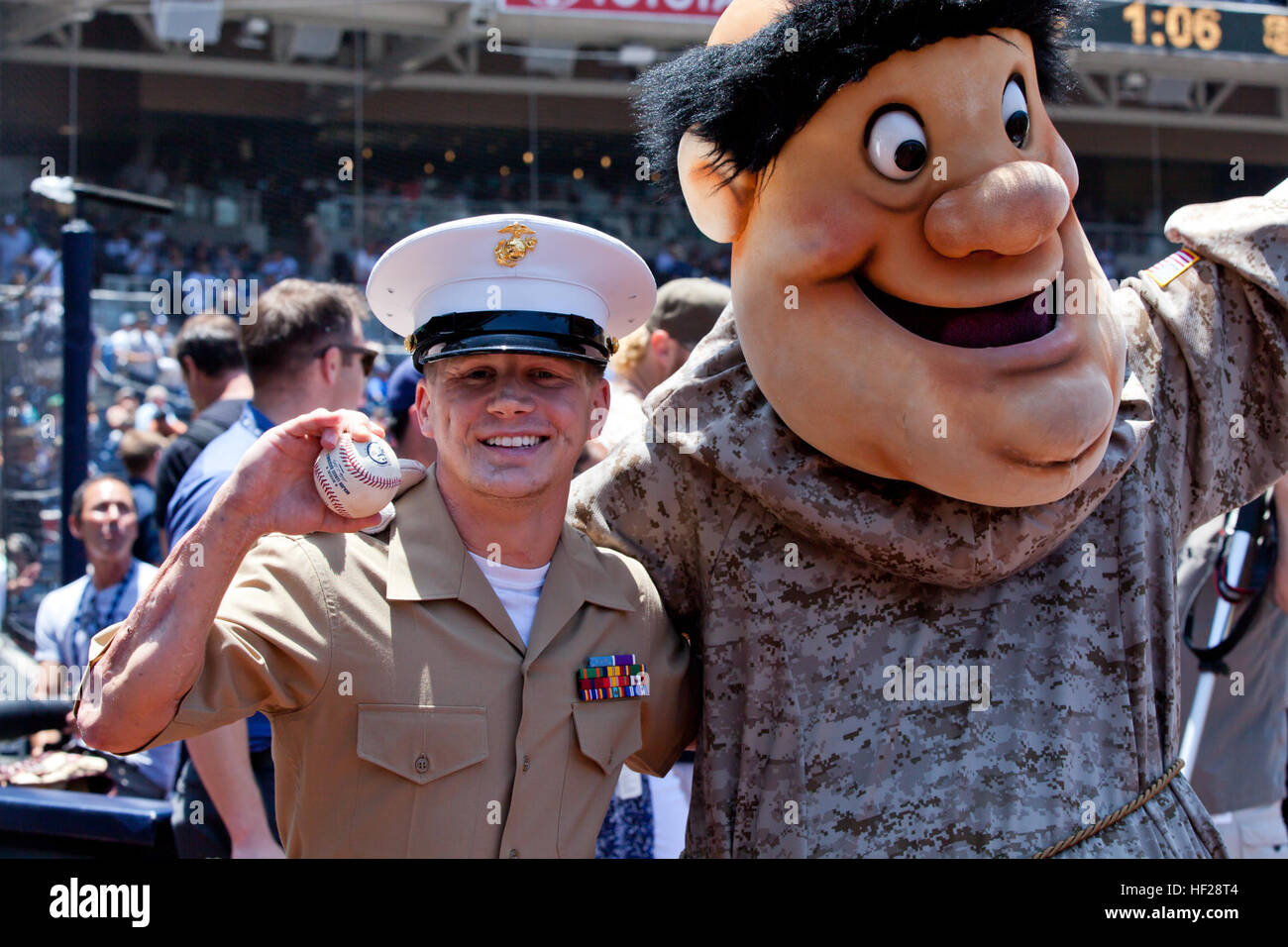 Retired U.S. Marine Corps Cpl. William Kyle Carpenter, left, poses for a photo with San Diego Padres mascot Swinging Friar after throwing the ceremonial first pitch during a baseball game at Petco Park in San Diego, Calif., June 22, 2014. The visit is part of a media tour after he was awarded the Medal of Honor at the White House on June 19, 2014. (U.S. Marine Corps photo by Cpl. Michael C. Guinto/Released) Medal of Honor Kyle Carpenter 140622-M-LI307-110 Stock Photo