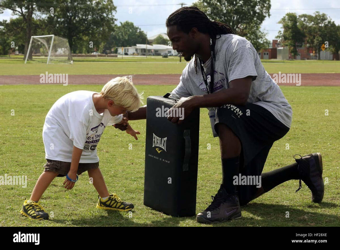 Football Rip Move Jeremiah J. (left), learns the defensive-lineman