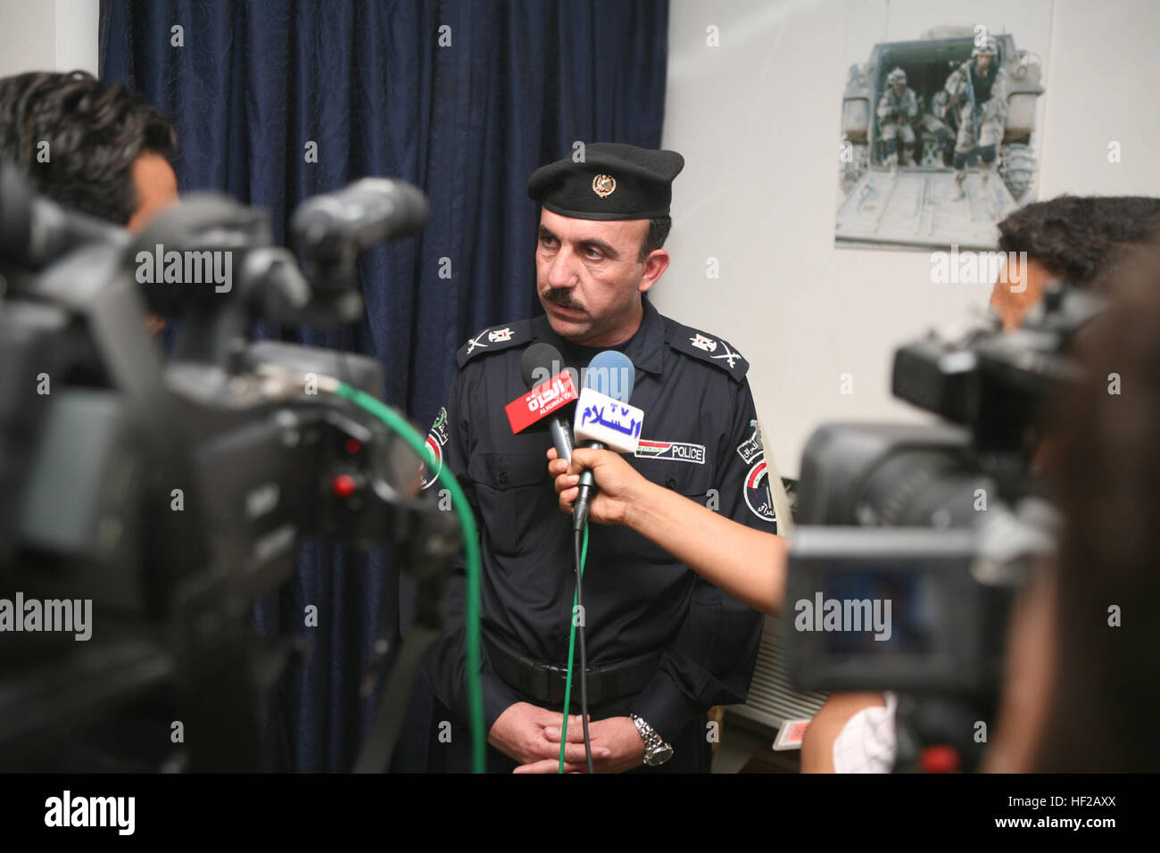 Maj. Gen. Tariq Yusif Aldulaymi, provincial chief of police in the Anbar province, is interviewed by a group of Iraqi reporters during a meeting on Camp Fallujah on Oct. 30, 2008, between the leaders of Anbar's Iraqi security force's, Multi National Force - West, and a deputy from the Iraqi Ministry of Interior. The meeting with the deputy from the MoI was held to discuss issues on the Iraq-Syria border in the Anbar province. Ministry of Interior meeting held at Camp Fallujah DVIDS125592 Stock Photo