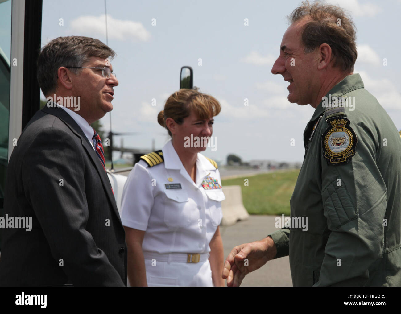 The First Sea Lord and Chief of Naval Staff of the British Royal Navy, Adm. Sir George Zambellas, right, greets personnel after arriving at Naval Surface Warfare Center at Dahlgren, Va., July 29, 2014. Zambellas is taking part in the Commandant of the Marine Corps' Counterpart Program, which invites foreign military leaders to visit the United States and interact with U.S. military leaders. (U.S. Marine Corps photo by Cpl. Michael C. Guinto/Released) First Sea Lord Counterpart Visit 140729-M-LI307-432 Stock Photo