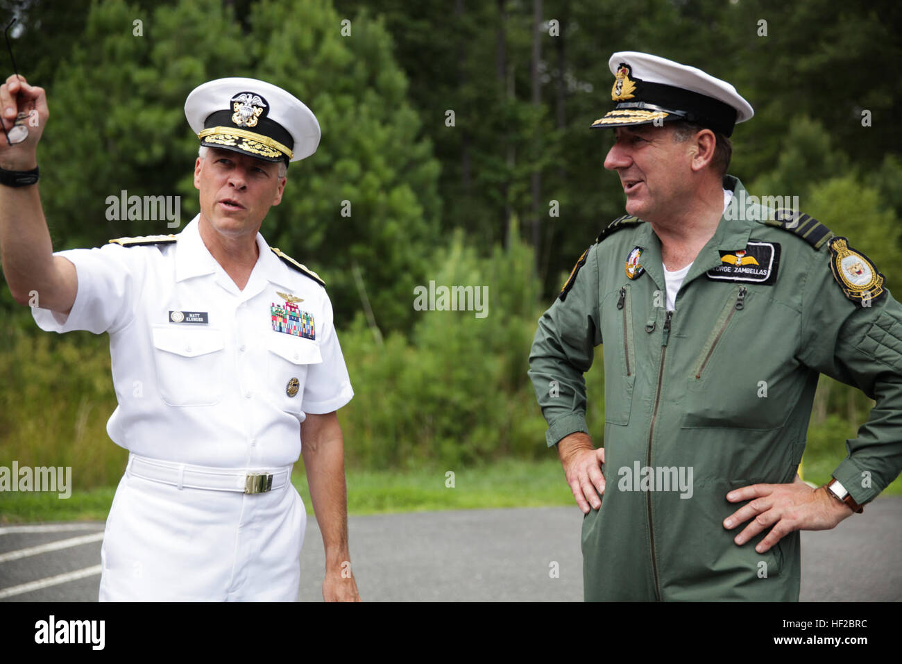 The First Sea Lord and Chief of Naval Staff of the British Royal Navy, Adm. Sir George Zambellas, right, speaks with U.S. Navy Rear Adm. Matthew L. Klunder after arriving at Naval Surface Warfare Center at Dahlgren, Va., July 29, 2014. Zambellas is taking part in the Commandant of the Marine Corps' Counterpart Program, which invites foreign military leaders to visit the United States and interact with U.S. military leaders. (U.S. Marine Corps photo by Cpl. Michael C. Guinto/Released) First Sea Lord Counterpart Visit 140729-M-LI307-437 Stock Photo
