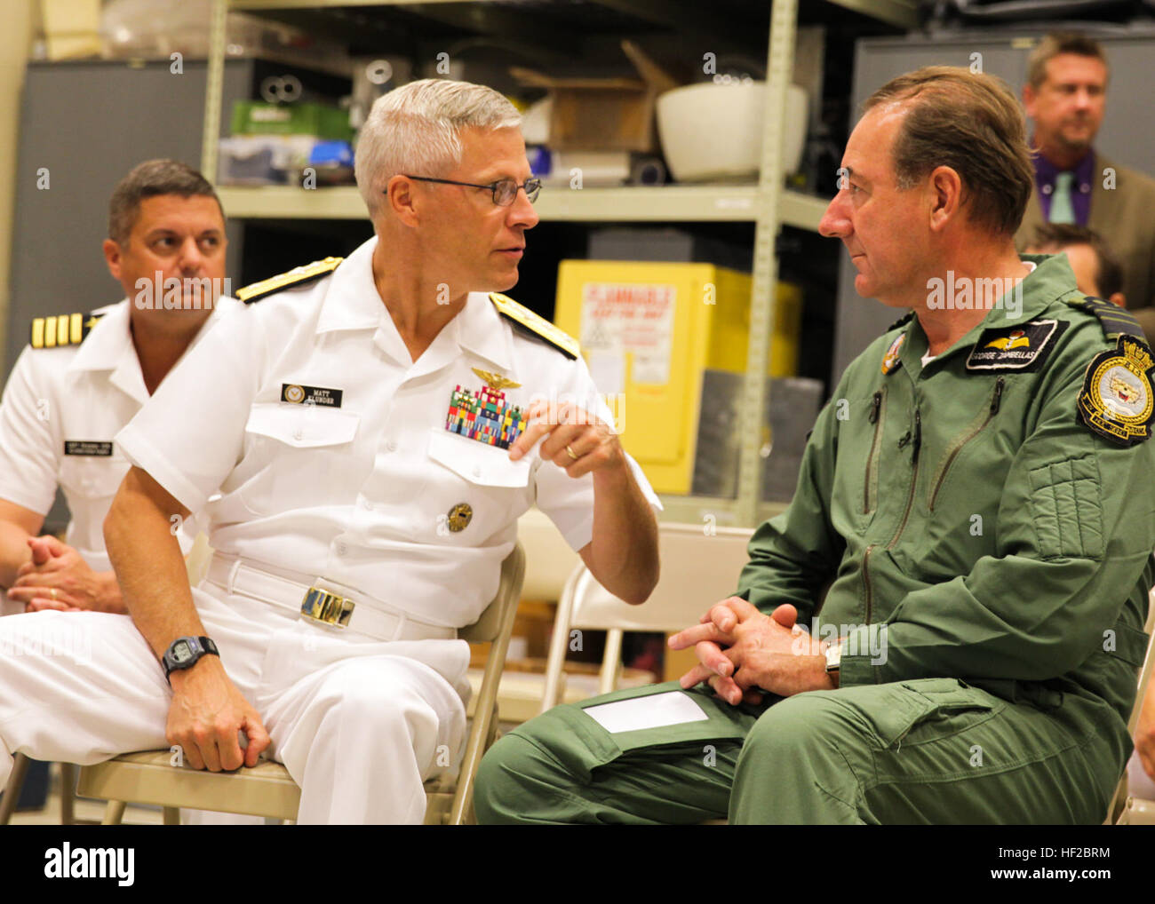 The First Sea Lord and Chief of Naval Staff of the British Royal Navy, Adm. Sir George Zambellas, right, speaks with U.S. Navy Rear Adm. Matthew L. Klunder during a visit at Naval Surface Warfare Center at Dahlgren, Va., July 29, 2014. Zambellas is taking part in the Commandant of the Marine Corps' Counterpart Program, which invites foreign military leaders to visit the United States and interact with U.S. military leaders. (U.S. Marine Corps photo by Cpl. Michael C. Guinto/Released) First Sea Lord Counterpart Visit 140729-M-LI307-454 Stock Photo