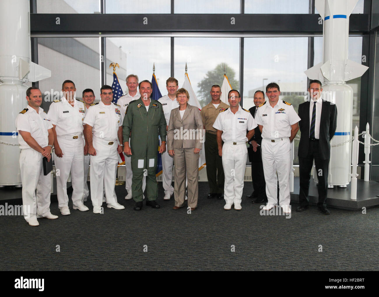 The First Sea Lord and Chief of Naval Staff of the British Royal Navy, Adm. Sir George Zambellas, front row center left, poses for a photo with U.S. Navy officers and civilian personnel during a visit at Naval Surface Warfare Center at Dahlgren, Va., July 29, 2014. Zambellas is taking part in the Commandant of the Marine Corps' Counterpart Program, which invites foreign military leaders to visit the United States and interact with U.S. military leaders. (U.S. Marine Corps photo by Cpl. Michael C. Guinto/Released) First Sea Lord Counterpart Visit 140729-M-LI307-461 Stock Photo
