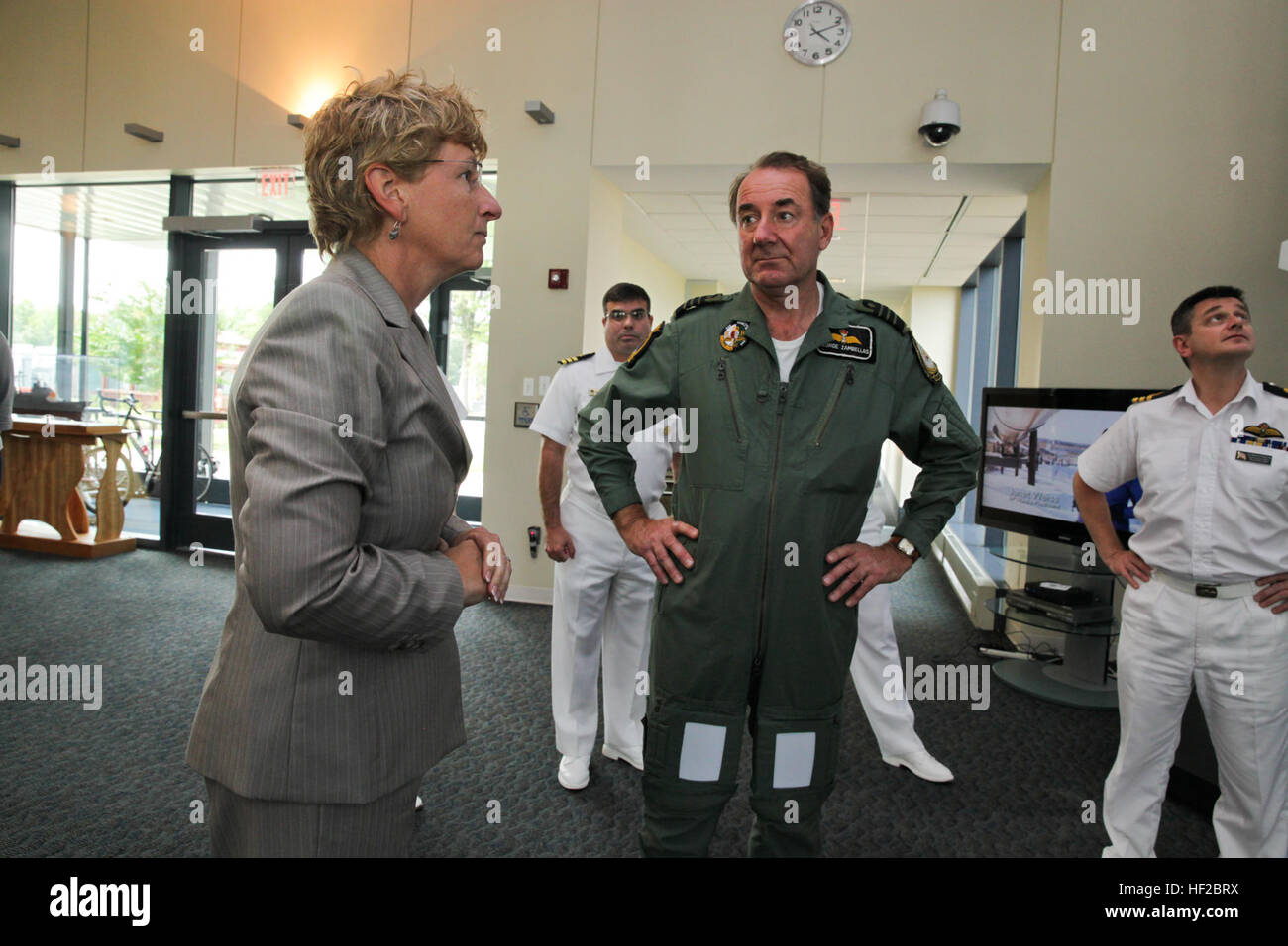 The First Sea Lord and Chief of Naval Staff of the British Royal Navy, Adm. Sir George Zambellas, center, receives a tour of the Missile Defense Agency by Laura DeSimone at Dahlgren, Va., July 29, 2014. Zambellas is taking part in the Commandant of the Marine Corps' Counterpart Program, which invites foreign military leaders to visit the United States and interact with U.S. military leaders. (U.S. Marine Corps photo by Cpl. Michael C. Guinto/Released) First Sea Lord Counterpart Visit 140729-M-LI307-465 Stock Photo