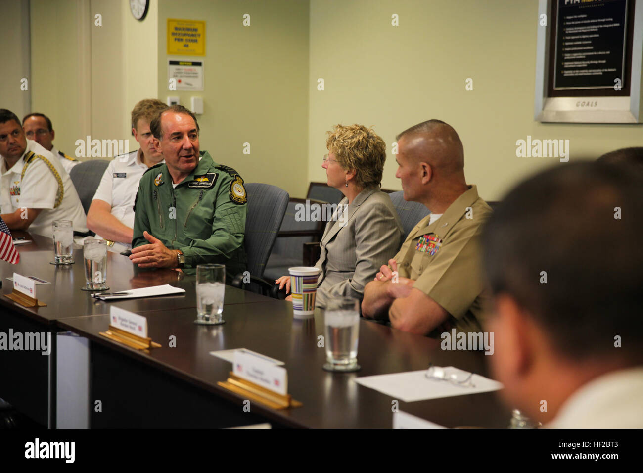 The First Sea Lord and Chief of Naval Staff of the British Royal Navy, Adm. Sir George Zambellas, left, attends a brief with U.S. Marine Corps and Navy personnel at the Missile Defense Agency at Dahlgren, Va., July 29, 2014. Zambellas is taking part in the Commandant of the Marine Corps' Counterpart Program, which invites foreign military leaders to visit the United States and interact with U.S. military leaders. (U.S. Marine Corps photo by Cpl. Michael C. Guinto/Released) First Sea Lord Counterpart Visit 140729-M-LI307-485 Stock Photo