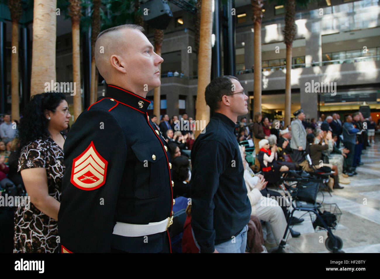 Retired Marine Staff Sgt. David Karnes stands at attention during the playing of the Marine's Hymn during a Quantico Marine Corps Band concert Nov. 10, 2008 at Battery Park in New York. Karnes was recognized for his rescue work during the attack on the World Trade Center, where he saved two law enforcement officers.  (Official Marine Corps photo by Lance Cpl. Brian Lewis.) 22nd Marine Expeditionary Unit, USS Bataan Members Attend Quantico Marine Band Performance DVIDS130835 Stock Photo