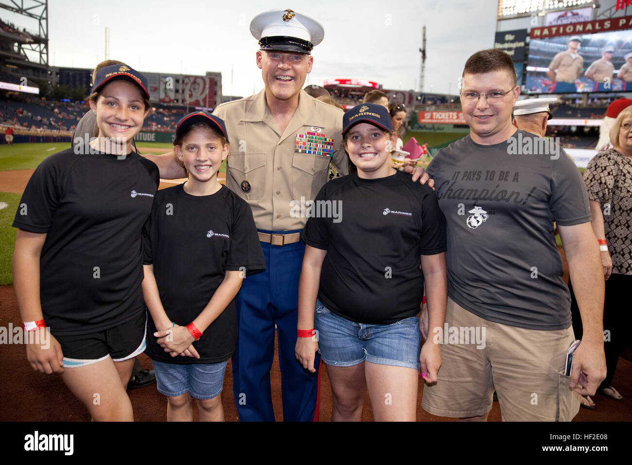 The 17th Sergeant Major of the Marine Corps, Sgt. Maj. Micheal P. Barrett, center, poses for a photo while attending the Washington Nationals' Marines Day baseball game in Washington, D.C., Aug. 20, 2014. (U.S. Marine Corps photo by Lance Cpl. Samantha K. Draughon/Released) Sergeant Major of the Marine Corps Attends Baseball Game 140820-M-EL431-028 Stock Photo