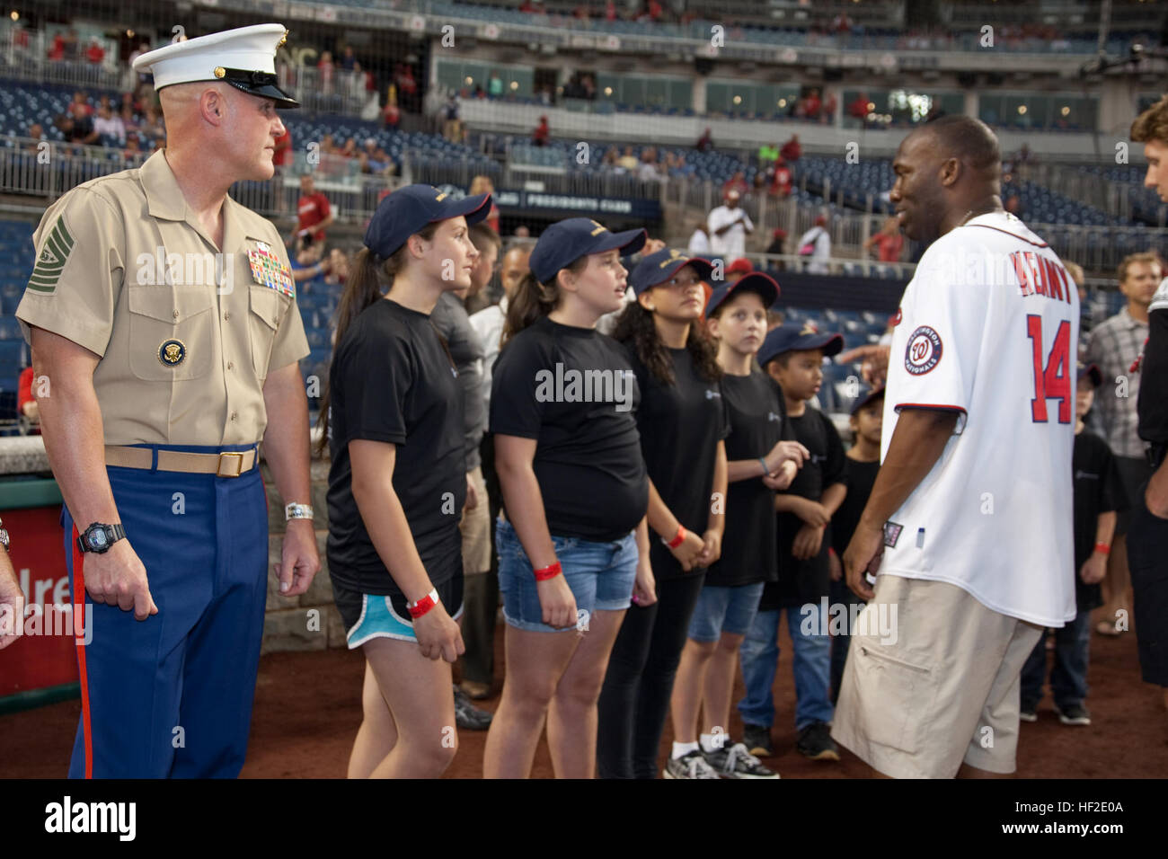 The 17th Sergeant Major of the Marine Corps, Sgt. Maj. Micheal P. Barrett, left, attends the Washington Nationals' Marines Day baseball game in Washington, D.C., Aug. 20, 2014. (U.S. Marine Corps photo by Lance Cpl. Samantha K. Draughon/Released) Sergeant Major of the Marine Corps Attends Baseball Game 140820-M-EL431-038 Stock Photo