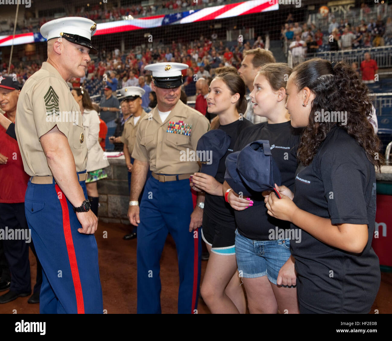 The 17th Sergeant Major of the Marine Corps, Sgt. Maj. Micheal P. Barrett, left, attends the Washington Nationals' Marines Day baseball game in Washington, D.C., Aug. 20, 2014. (U.S. Marine Corps photo by Lance Cpl. Samantha K. Draughon/Released) Sergeant Major of the Marine Corps Attends Baseball Game 140820-M-EL431-072 Stock Photo