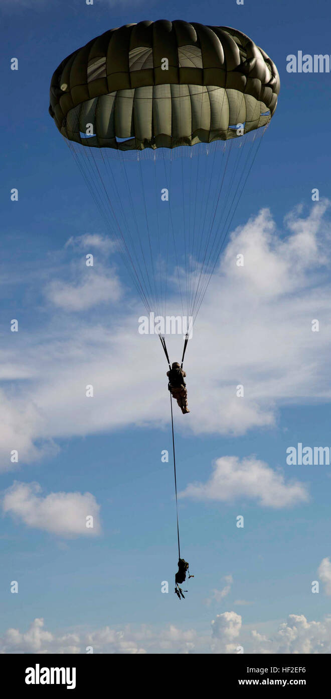 Low Level Static Line Cpl. David Meneses descends toward the ground following a 1,250-foot ...