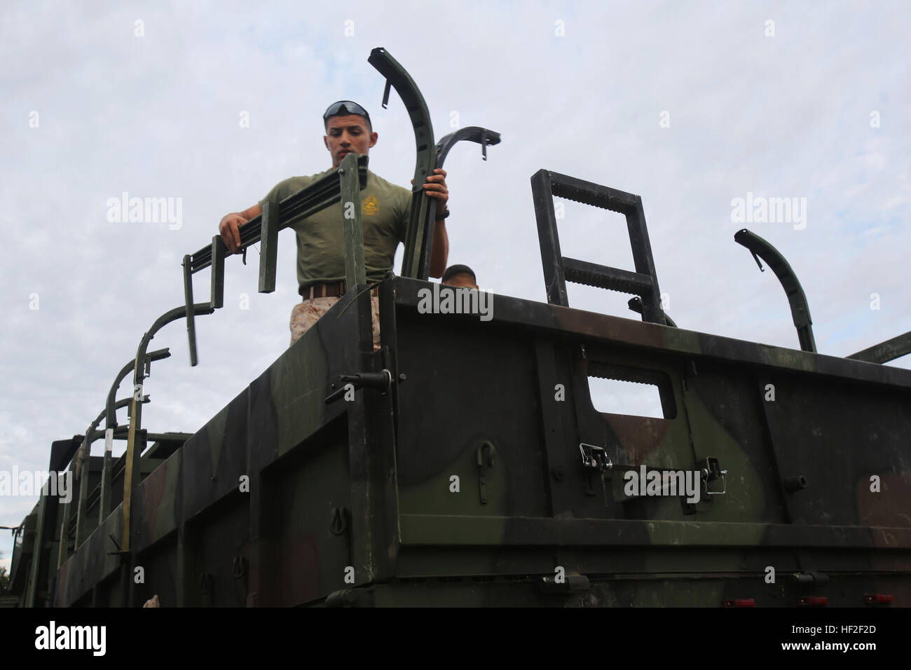 A U.S. Marine with General Support Motor Transportation Company (GSMT Co.), Combat Logistics Regiment 2, 2nd Marine Logistics Group, prepares a Logistics Vehicle System Replacement for troop movement on Fort A.P. Hill, Virginia, Sept. 3, 2014. The Marines of GSMT Co. provided 3rd Battalion, 2nd Marine Regiment, 2nd Marine Division with transportation, food, and water during their training at Fort A.P. Hill. (U.S. Marine Corps photo by Lance Cpl. Desire M. Mora/ Released) CLR-2 Marines provide support to 3rd Battalion 2nd Marine Regiment at Fort A.P. Hill 140903-M-TG562-006 Stock Photo