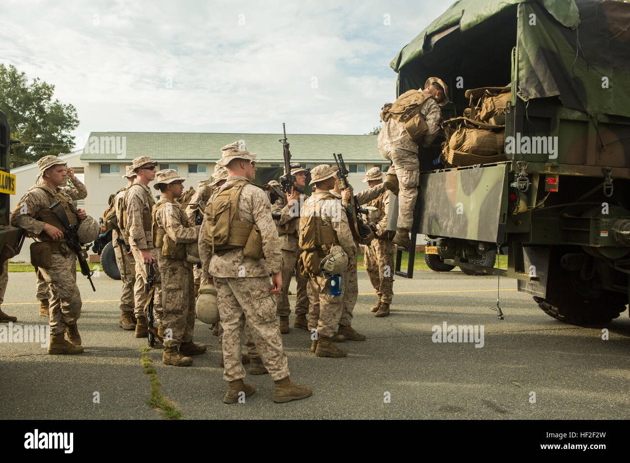 U.S. Marines with General Support Motor Transportation Company (GSMT Co.), Combat Logistics Regiment 2, 2nd Marine Logistics Group, prepare Logistics Vehicle System Replacements for troop movement on Fort A.P. Hill, Virginia, Sept. 3, 2014. The Marines of GSMT Co. provided 3rd Battalion, 2nd Marine Regiment, 2nd Marine Division with transportation, food, and water during their training at Fort A.P. Hill. (U.S. Marine Corps photo by Lance Cpl. Desire M. Mora/ Released) CLR-2 Marines provide support to 3rd Battalion 2nd Marine Regiment at Fort A.P. Hill 140903-M-TG562-104 Stock Photo