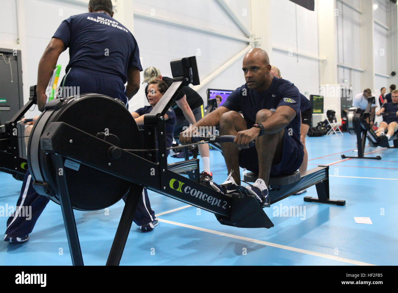 Indoor Rowing Army A Marine participates in an indoor rowing session during the first day ...