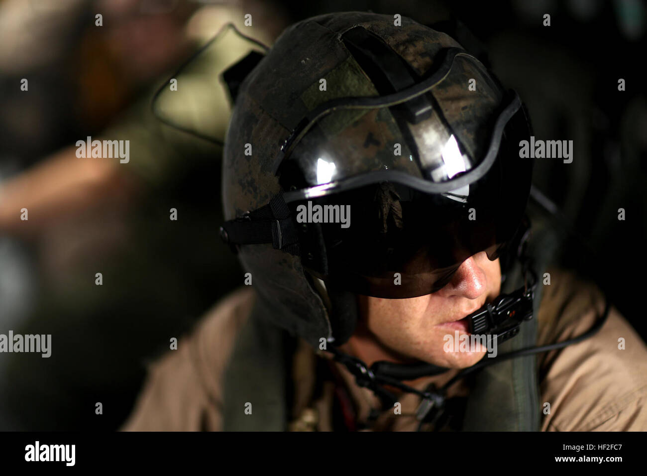 U.S. Marine Corps Master Sgt. Michael J. Cuttic, a crew chief assigned to Marine Heavy Helicopter Squadron (HMH) 366, looks out of a CH-53E Super Stallion aboard Ft. Ambrose Powell Hill, Va., Sept. 9, 2014. HMH-366 transported Marines with 3rd Battalion, 2nd Marine Regiment into a simulated combat zone during a training exercise. (U.S. Marine Corps photo by Lance Cpl. Jodson B. Graves/Released) HMH-366 conducts Training Exercise 140909-M-SW506-030 Stock Photo