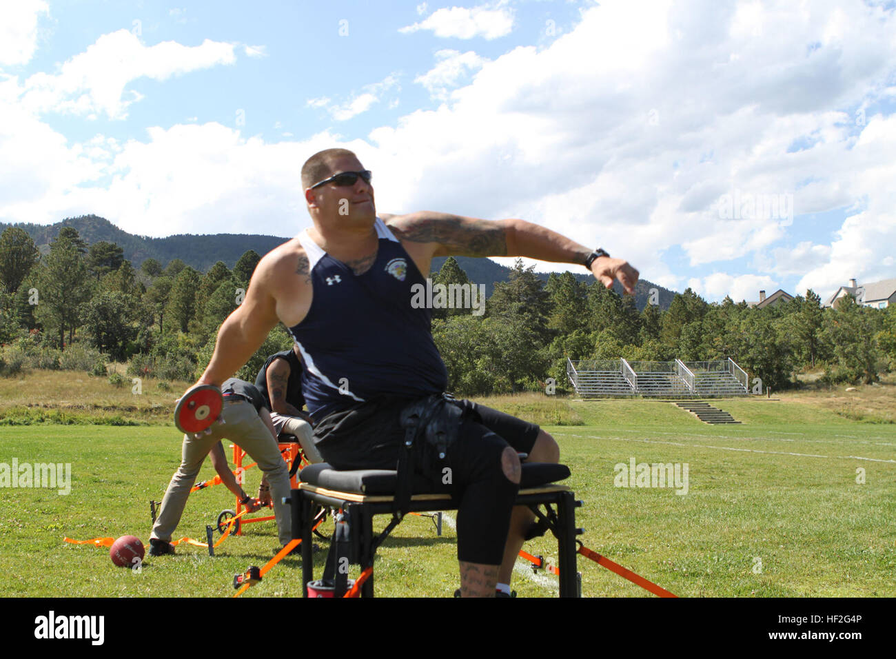 A Marine practices seated discus during field training at over 6,000 ...
