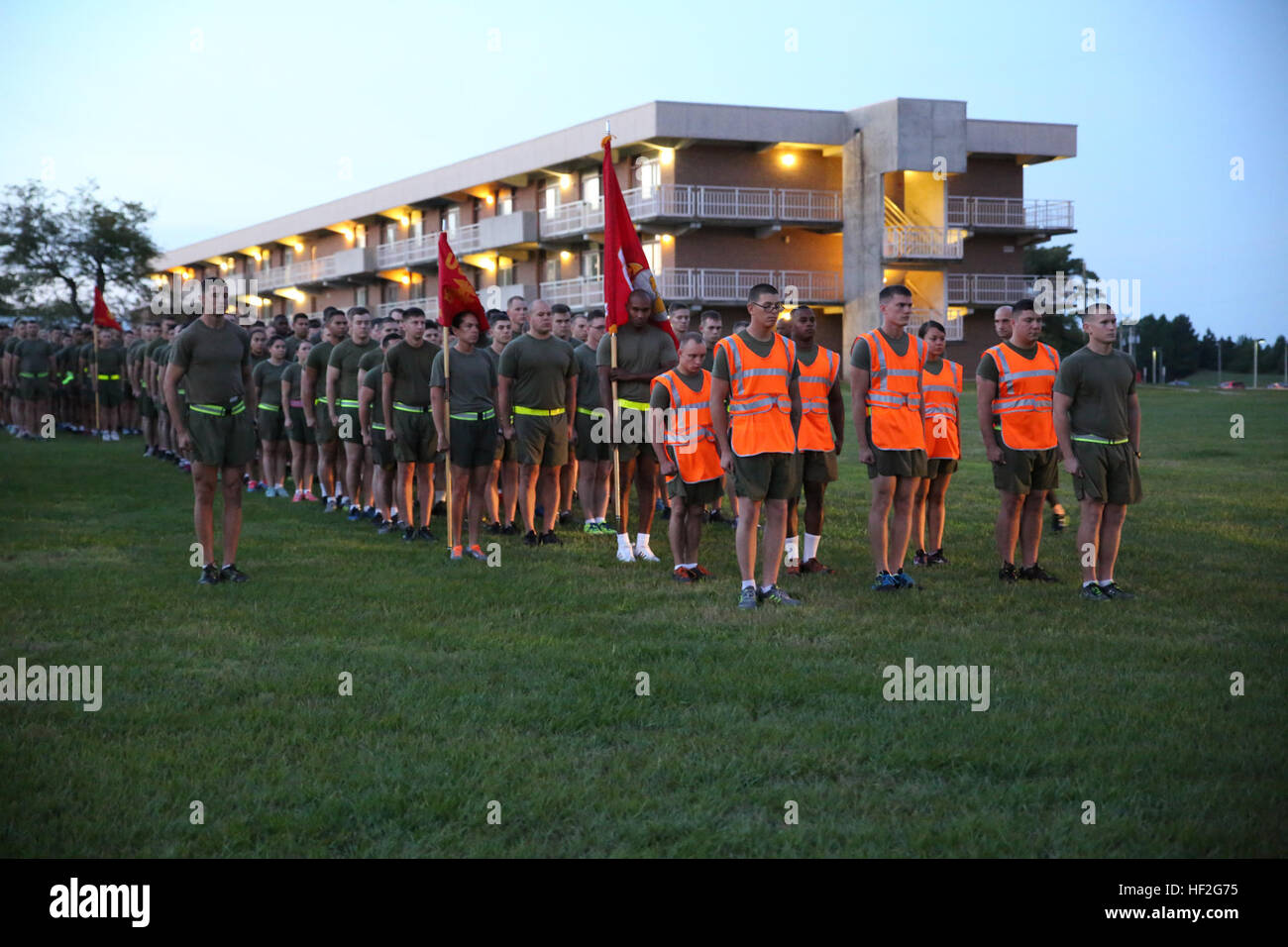 Marines and sailors with the Ground Combat Element Integrated Task Force prepare to step off on their unit run aboard Marine Corps Base Camp Lejeune, North Carolina, Sept. 19, 2014. The run was in celebration of the uncasing of the units organizational colors. The task force ran three miles, calling cadence and showcasing guidons along the way. From October 2014 to July 2015, the Ground Combat Element Integrated Task Force will conduct individual and collective skills training in designated combat arms occupational specialties in order to facilitate the standards based assessment of the physic Stock Photo
