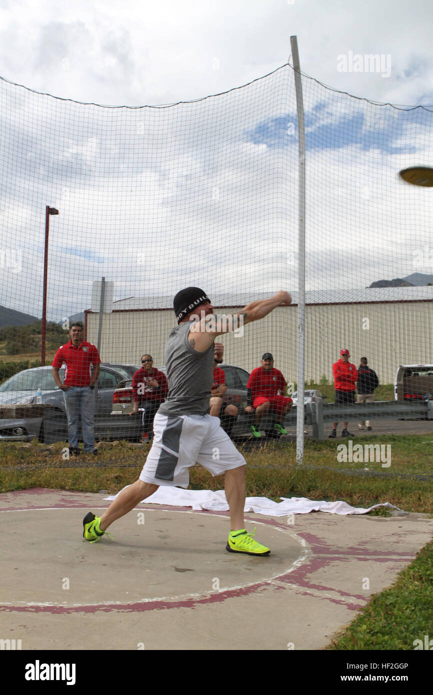 A Marine athlete throws the discus during field training in preparation ...